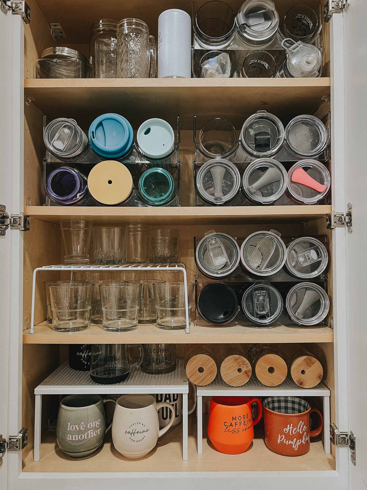 Kitchen cabinet organization that works! 

Cabinet risers. Tumbler organizer. Mug organization  

#LTKSale #LTKhome #LTKFind