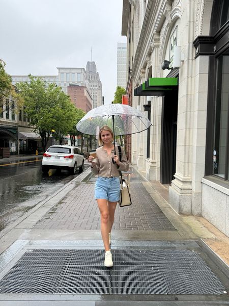 Rainy city Europe vibes outfit spring and summer casual from Abercrombie 

Beige cardigan with pearl buttons, essential brown tank, high rise dad shorts, Veja cream sneakers, clear umbrella, Marc Jacobs medium tote

#LTKfindsunder100 #LTKstyletip #LTKSeasonal