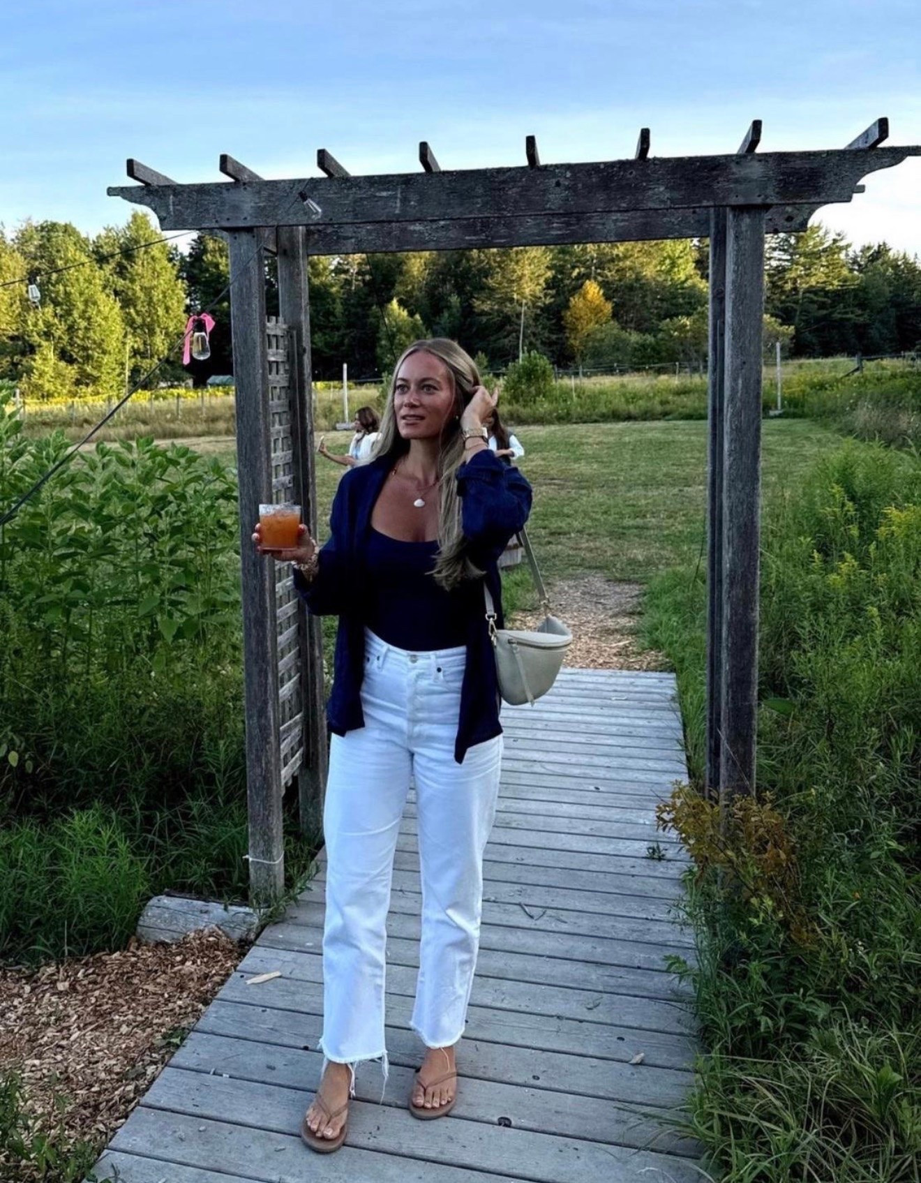 Perfect transitional outfit wearing navy blue button down with padded Amazon tank and the best white jeans

#LTKootd #LTKSeasonal