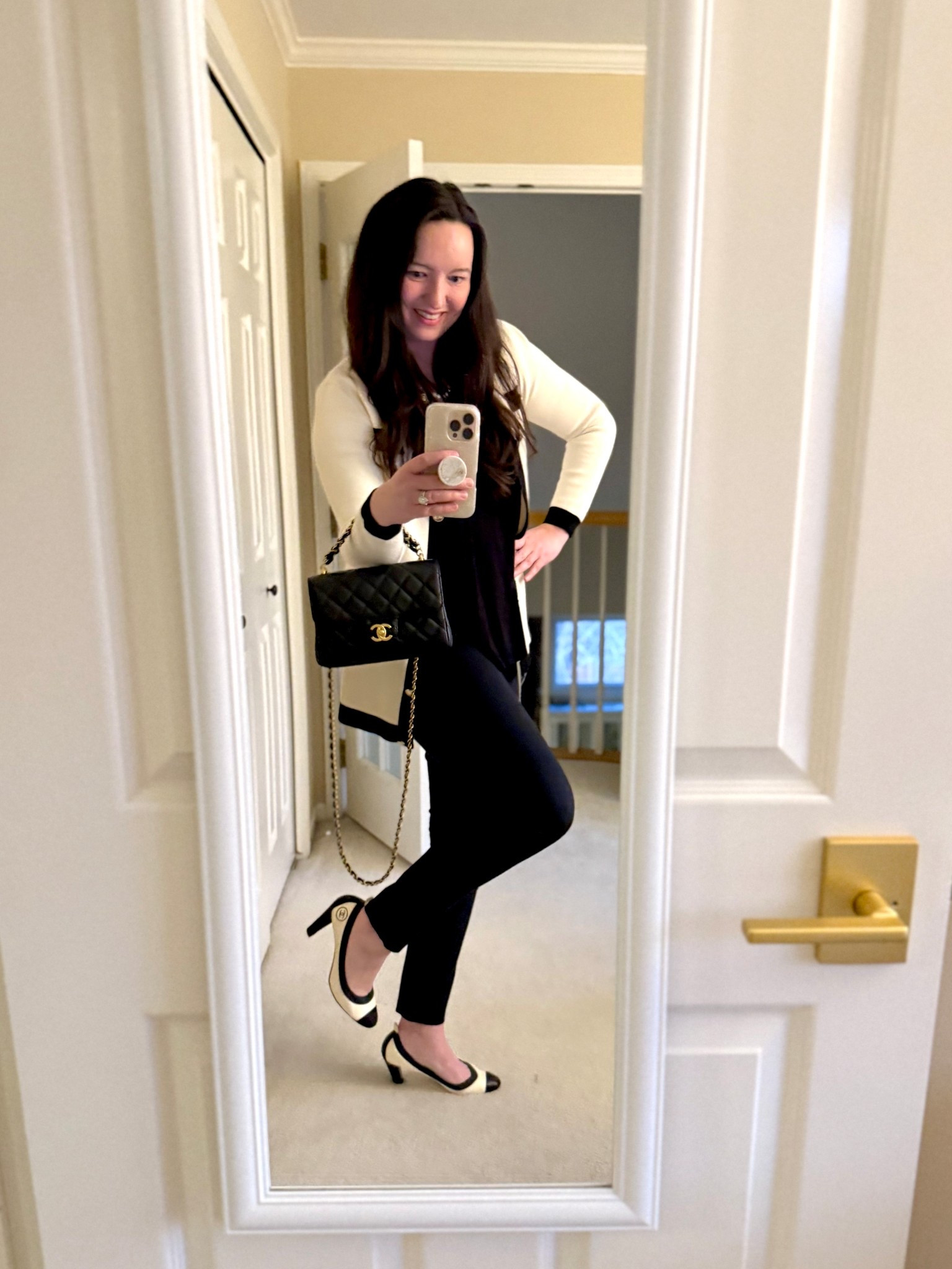 Chanel chic outfit! Paired this older H&M cream and black cardigan with gold buttons with my Chanel Vintage Spirit pumps I bought about 15 years ago that perfectly match.  Topped everything off  with my new Chanel  Small Flap with double chain top handle, which I am obsessed with!  Grab it while you can, as this is a Fall/Winter 25 Collection piece.  So hard to find caviar leather small flap bags with crossbody straps that fit taller people!  This is perfect for my 5’7” frame.  It is very light weight and has vintage gold hardware, which I LOVE and prefer over the muted champagne gold that they normally carry.  So happy to have found this bag in Vegas at the Wynn Chanel boutique!  

Similar and used items linked below!