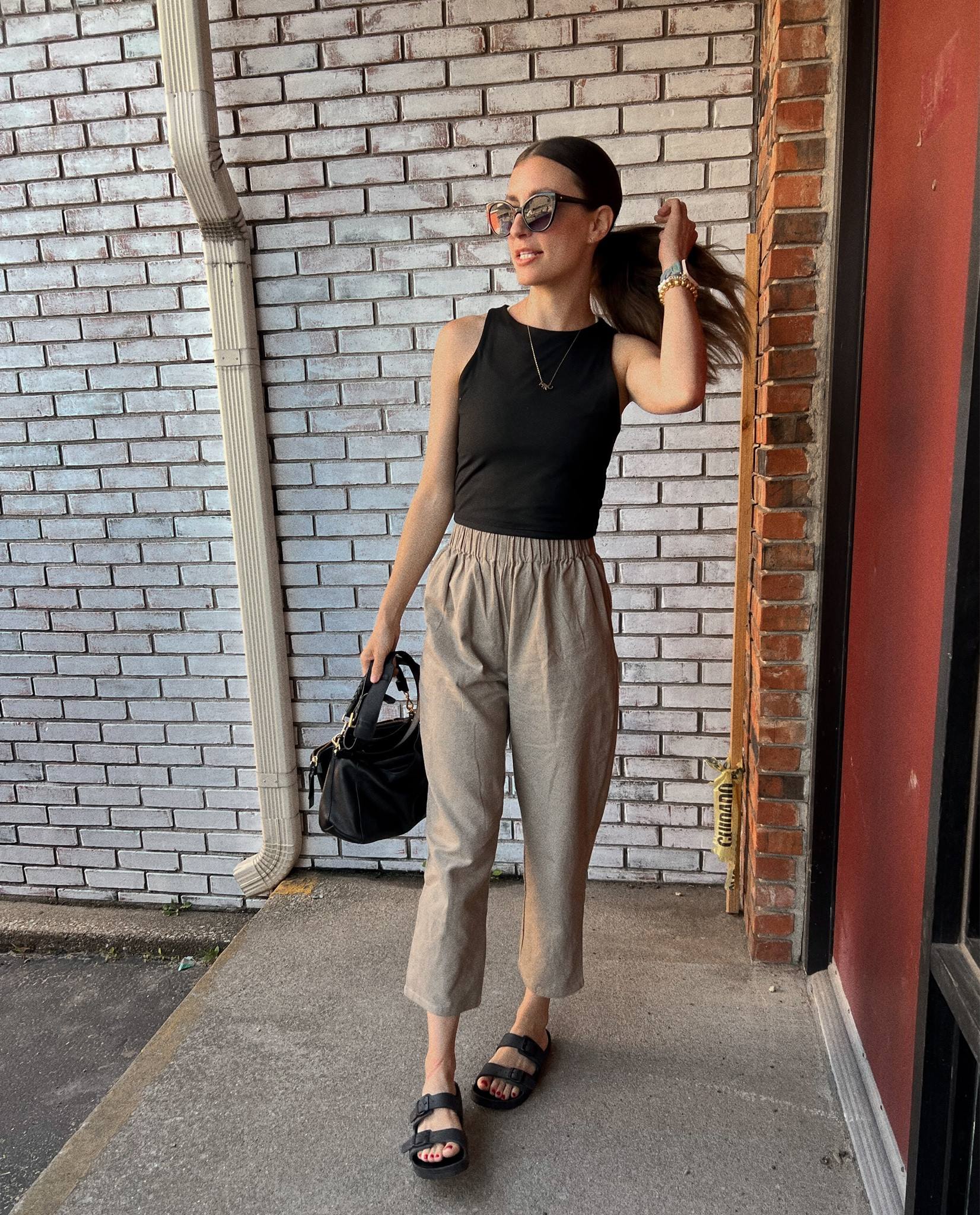 Wearing size small in the top and XS in pants (recommend sizing down!). Use code ITSMEG15 for all ABLE items - crossbody purse, pants, jewelry