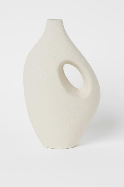 Large stoneware vase designed for long-stemmed flowers. Decorative hole at one side. Width at bas... | H&M (US)