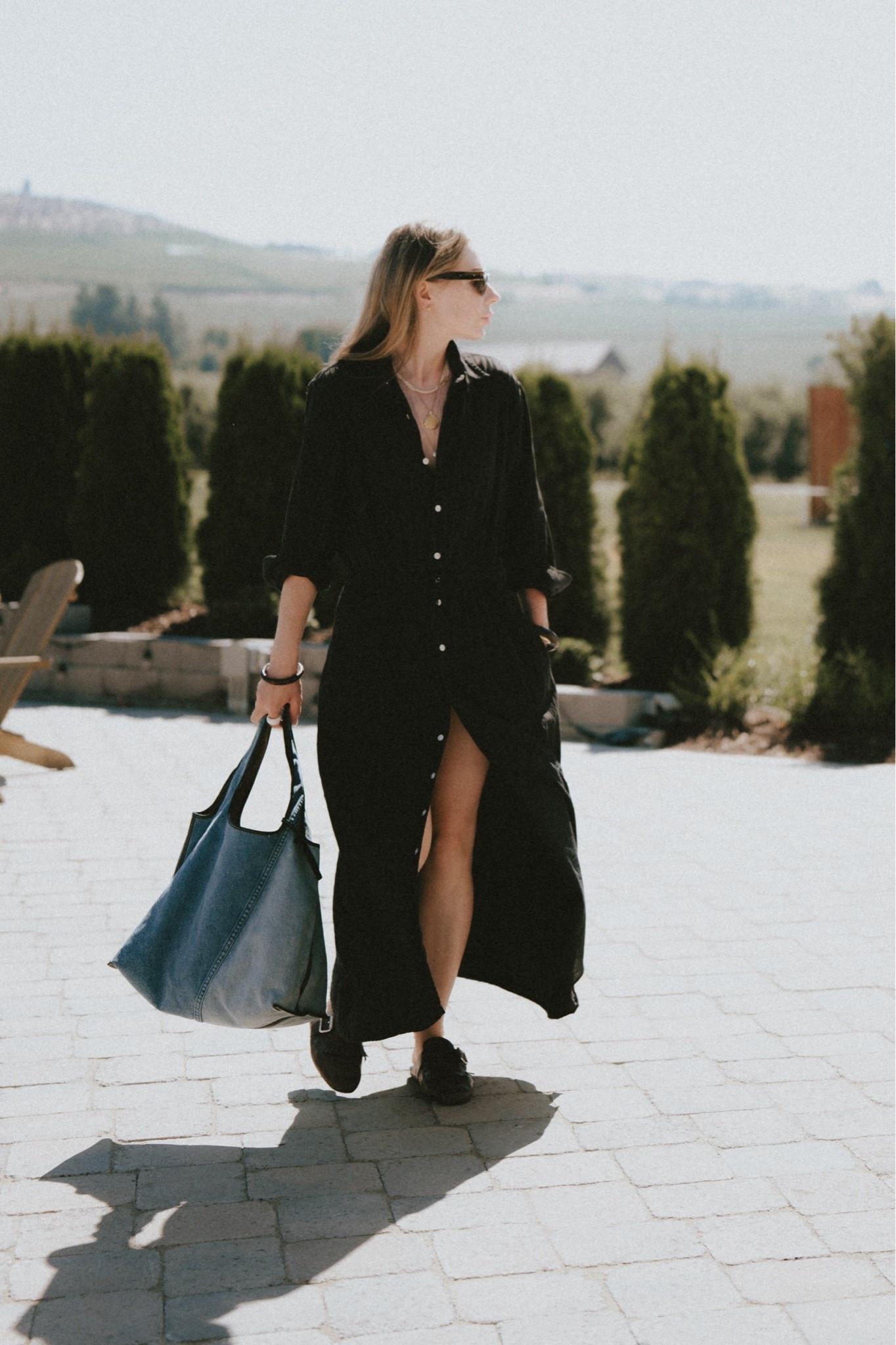 Outfit idea: Long black dress + mules + denim tote + statement jewelry 
Dress: older Buck Mason, similar linked 
Mules: Prada Shuffle
Bag: 3.1 Phillip Lim Market tote

#LTKootd #LTKSeasonal #LTKWorkwear