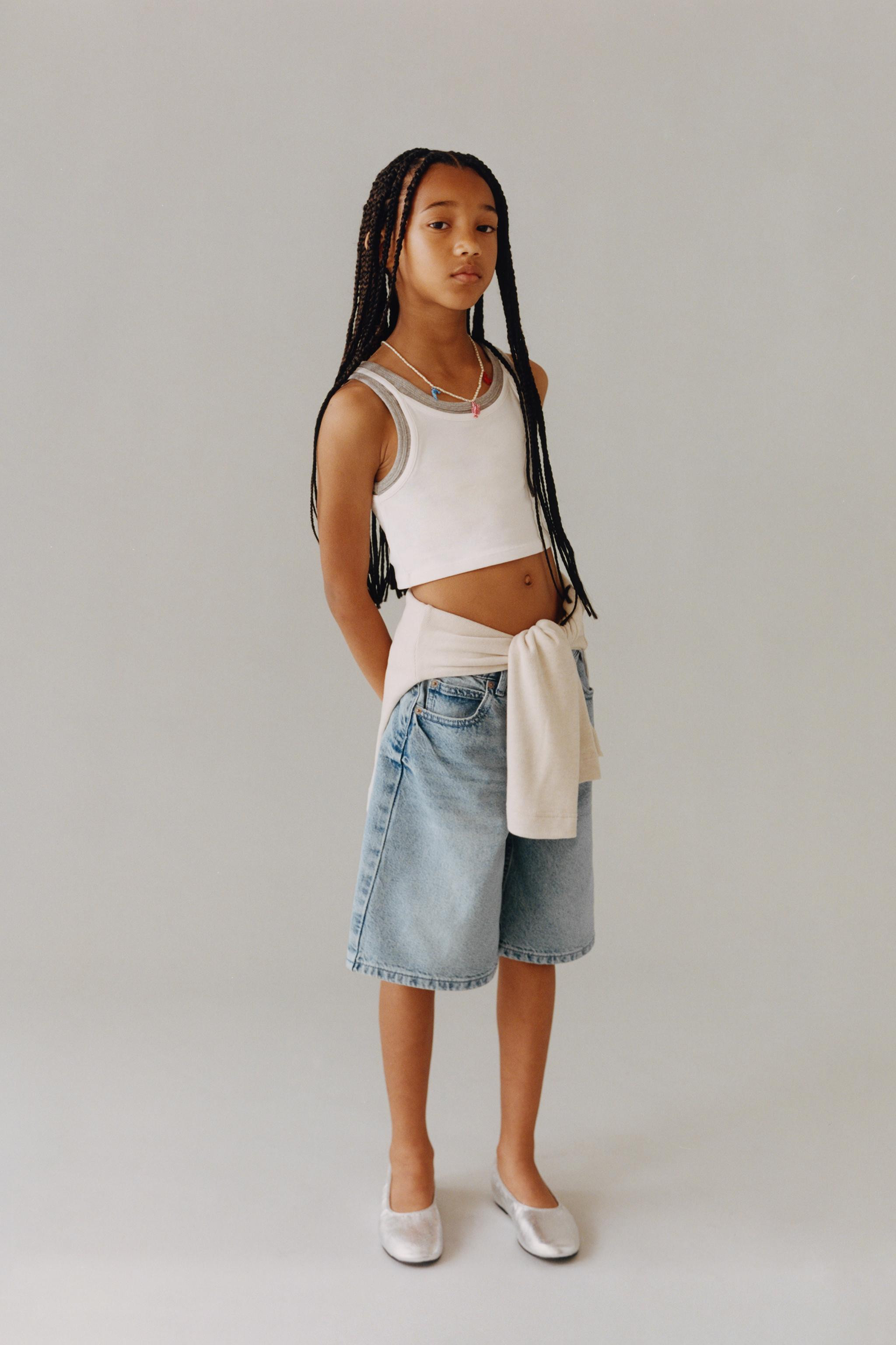 Round neck tank top. Contrasting overlay detail. | Zara US