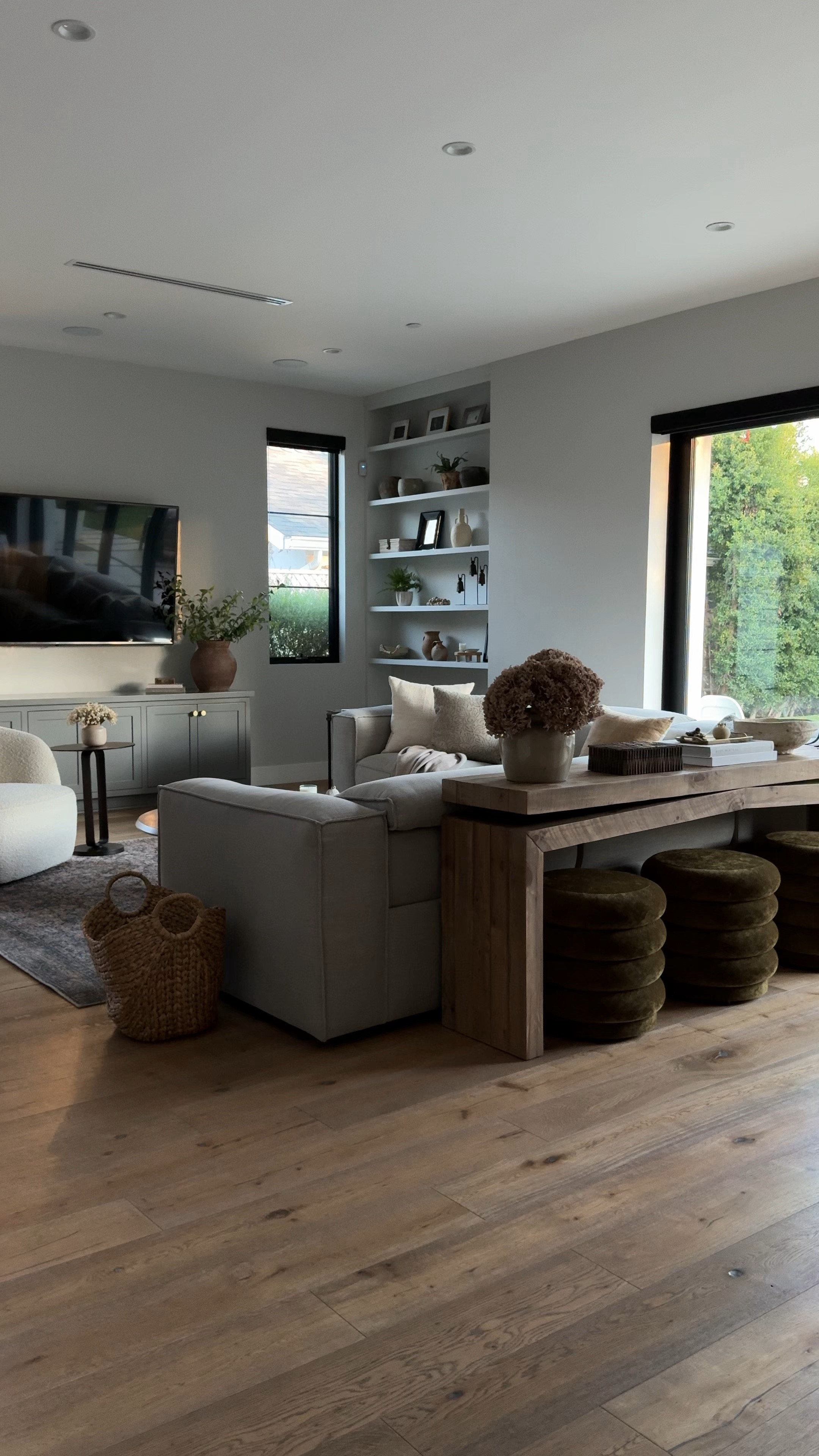 Wood console table ottoman vintage vase hydrangeas dried flowers box candle holder taper  candles McGee brown vase green eucalyptus, leaves, fake leaves, gray sofa, sectional, motion, sofa, white swivel chair, Accent chair, paper, mesh bowl, hydrangea, metal, side, table, and table. Candles, McGee, Kathy kuo, CB2,


#LTKfindsunder100 #LTKsalealert #LTKhome