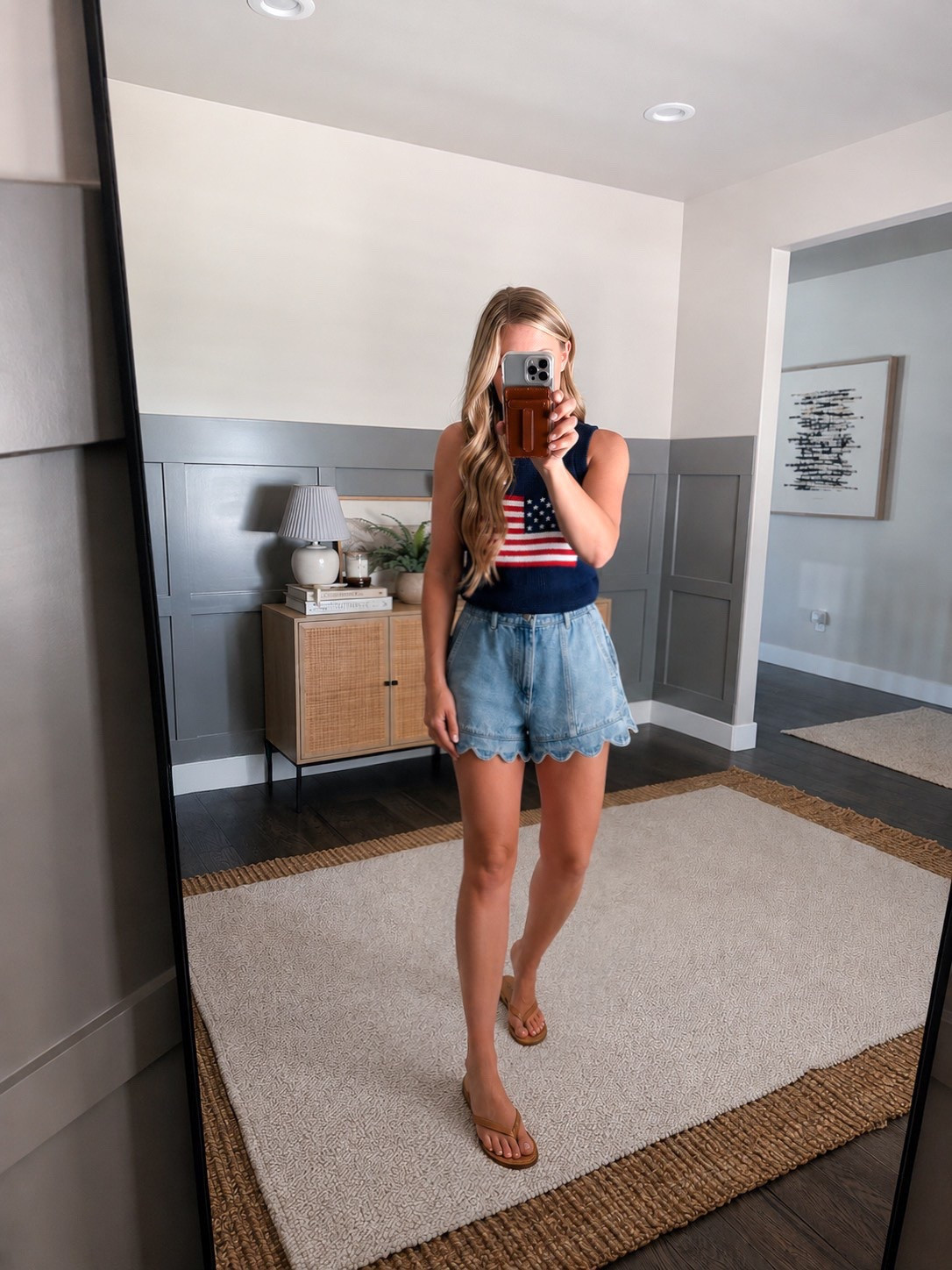 This is the kind of outfit I live in all summer. The American flag sweater tank is perfect for cool mornings, late-night fireworks, backyard BBQs, lake days & everything in between. Paired with these scalloped Farm Rio denim shorts, it feels classic with just enough feminine detail to make it a little more fun. Definitely one of my favorite summer combinations. Sweater S small. Shorts size up 1 size. 

Fourth of July outfit, 4th of July style, patriotic outfit, American flag sweater, sweater tank, summer outfit, lake outfit, BBQ outfit, fireworks outfit, vacation outfit, weekend style, coastal style, casual chic, denim shorts, scalloped denim shorts, ruffle denim shorts, summer fashion, Americana style, effortless style, feminine outfit inspiration

#LTKootd #LTKdayinmylife #LTKvlog