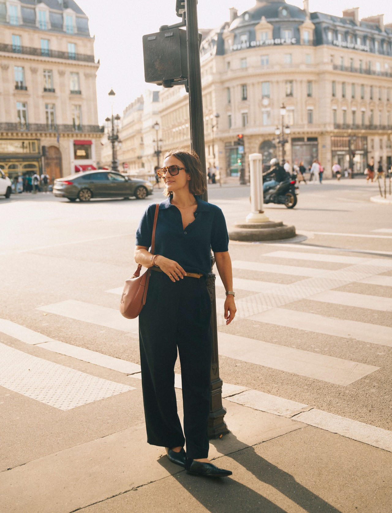 A monochromatic navy outfit for exploring Paris. I tucked a short-sleeve knit polo into wide-leg trousers, then added a slim belt and pointed-toe flats for a classic, streamlined finish. The brown bag and tortoiseshell sunglasses add just the right amount of contrast.  

 #LTKootd #LTKSeasonal
