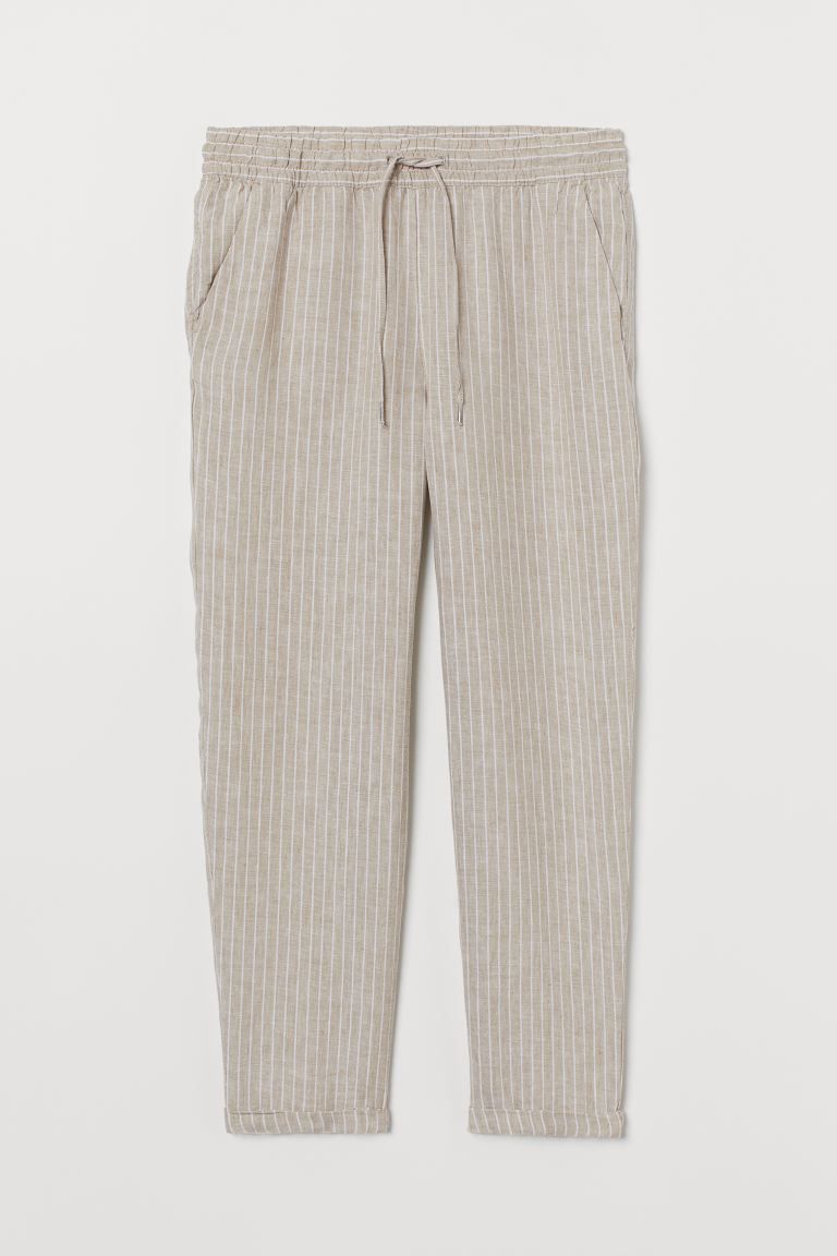 Linen joggers with a regular waist. Elasticized drawstring waistband, side pockets, and mock back... | H&M (US + CA)