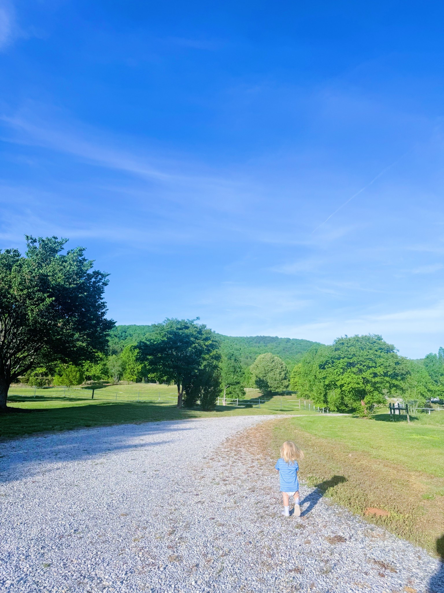 A baby 👶🏼 in a diaper 🤍 and boots 🥾 cannot be stopped 🤭 - also… our driveway 🛻 view y’all 🌳😍🙌🏽