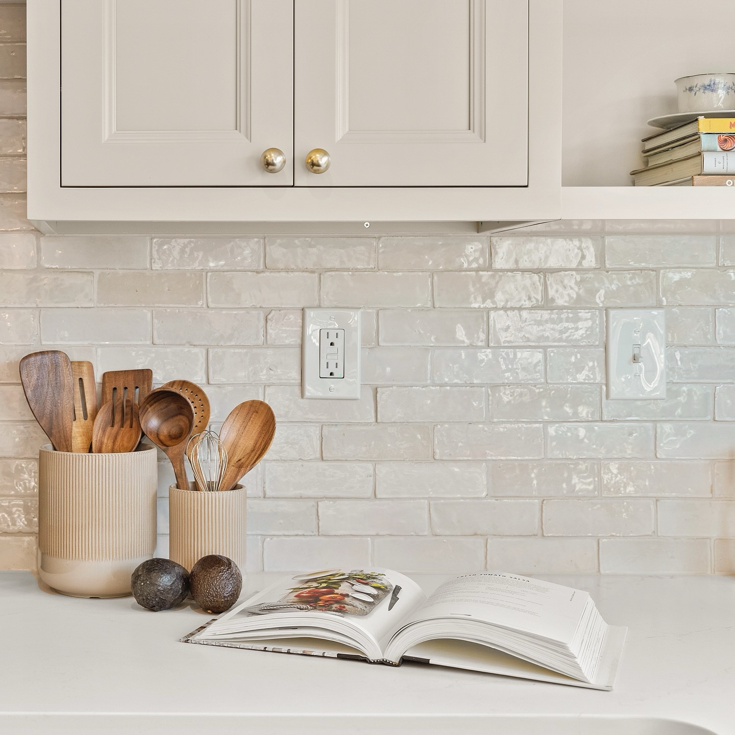 As a sneak peak into our kitchen remodel in South Fayette, I want to introduce Farrow&Ball - No. 4 Old White. One of their traditional neutrals, Old White can read as a subdued green, particularly in north facing rooms, but feels more of a classic greige in well lit spaces. Mixed with Zia’s Zellige tile, and we have a chef’s kiss for this kitchen corner! 

Photos: @khhomephotos 
Styling: @funcydeco 
GC: @akn_interiors 

#thorntonid #interiordesign #pittsburghinteriordesigner #kitchenandbathdesign #kitchendesign #kitchendecor #kitchenremodel