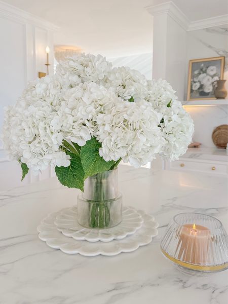 This fluted vase has gone viral for a reason. 👏🏼 It’s under $30 and the contemporary style is beautiful. The size is perfect for a large grouping of stems. 🌿
My petal trays are another favorite. I like to layer mine and place a candle or vase of flowers on top. 
#LTKMostLoved 

#LTKfindsunder50 #LTKhome