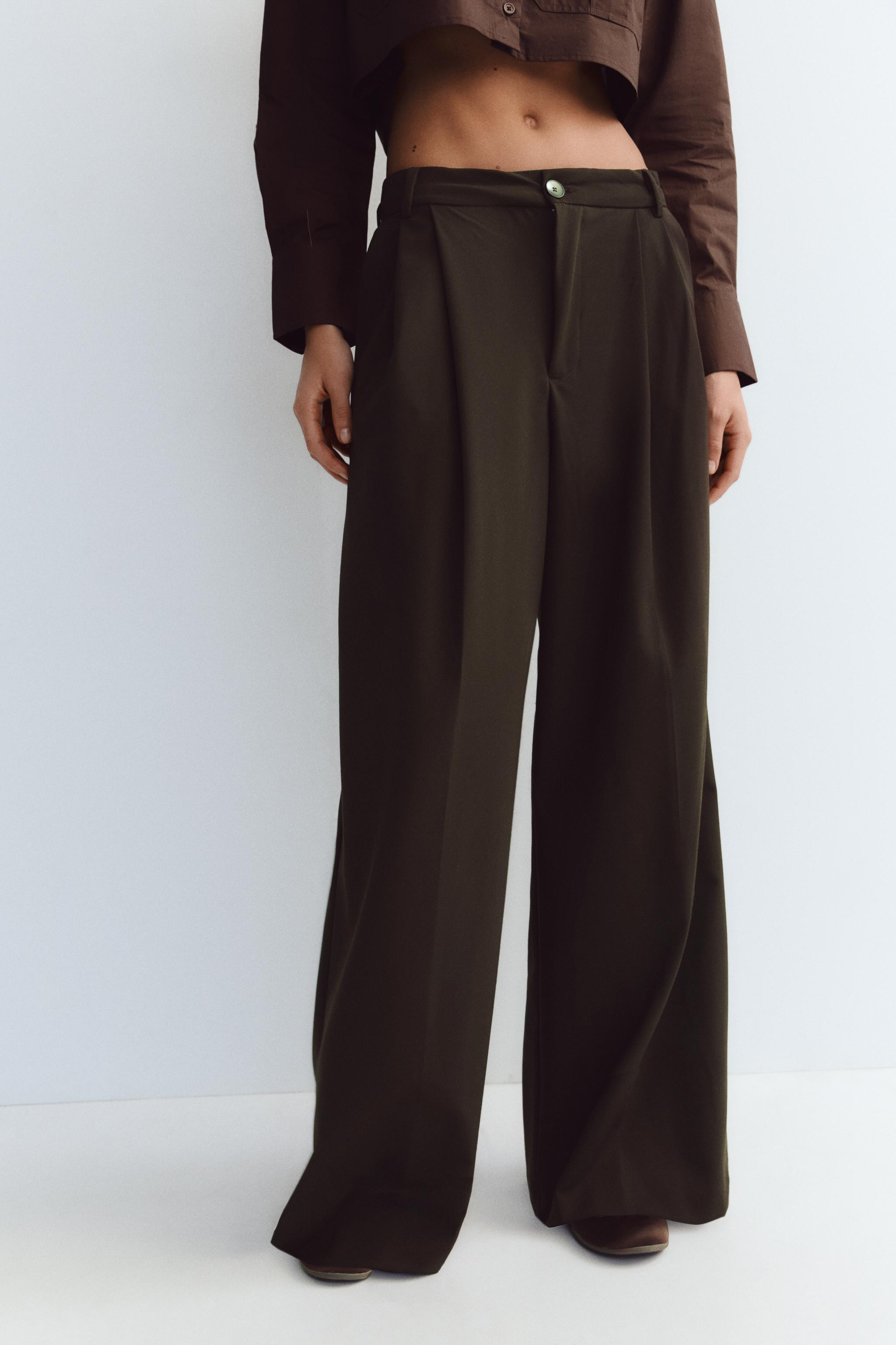 Pants with a high waist and belt loops. Double pleat detail. Side pockets and back false welt poc... | Zara US
