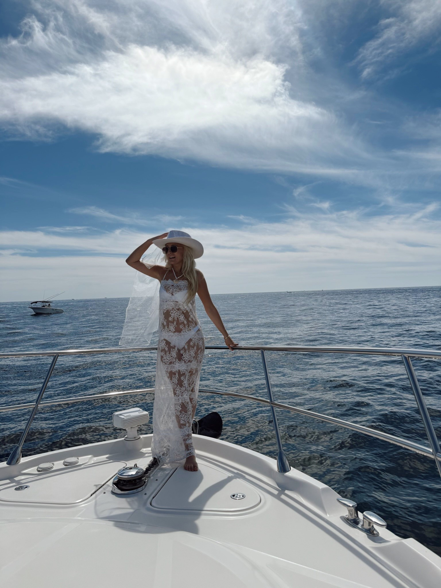 Hat with veil attached is from Anthropologie but sold out so I linked similar. 
Cabo bachelorette yacht day / boat / bridal / swimsuit coverup / beachwear / vacation / lace dress / hat with veil 

#LTKFestival #LTKSwim #LTKWedding