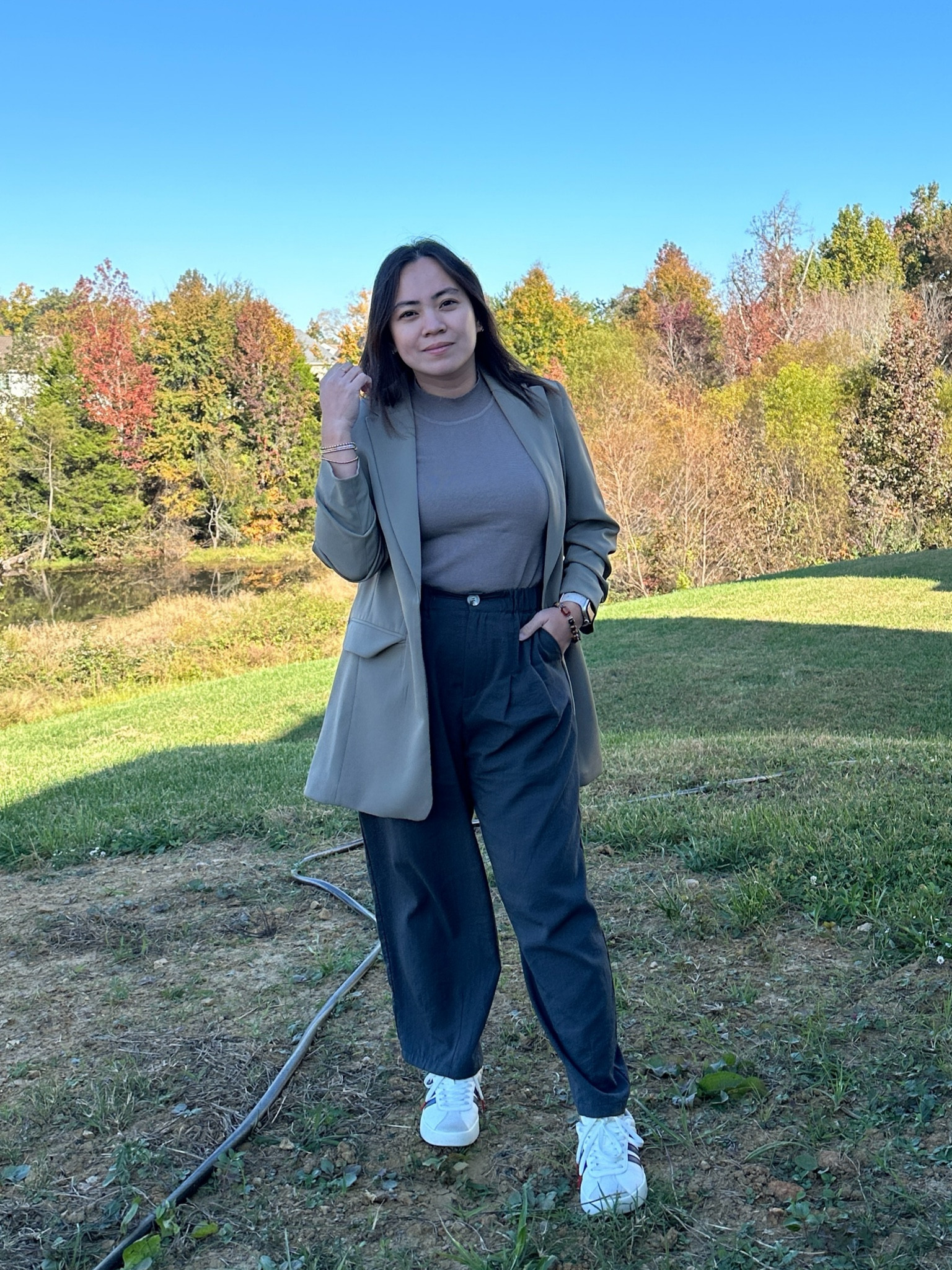 Effortlessly chic for everyday style! This neutral blazer adds a polished touch, while the high-waisted trousers elongate the silhouette—perfect for petite frames. A fitted top keeps the look sleek and balanced, and white sneakers bring casual comfort for all-day wear. Ready for anything the day throws your way!

#LTKMidsize #LTKStyleTip #LTKGiftGuide