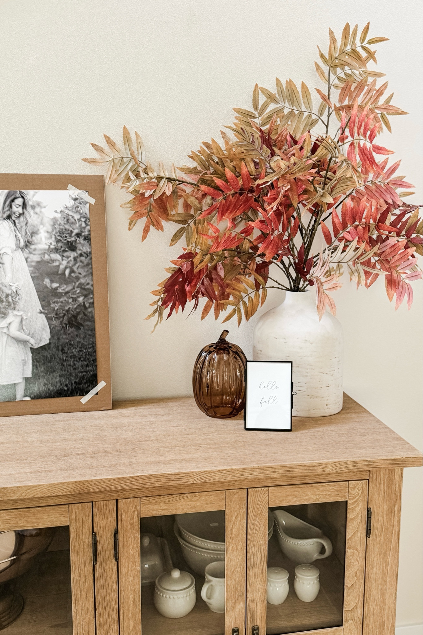 I love walking past this little autumnal scene in our entryway — it really sets the whole vibe of our home each season. 

(I REALLY need to get some frames for our printed family photos though 🫣)

#LTKHome #LTKSeasonal