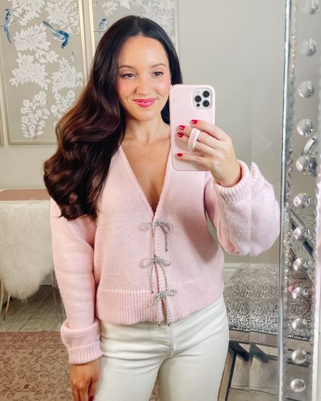 This pink bow cardigan is to die for!!! So cute and very high quality from Saks Fifth Avenue! Love the cropped cardigan fit for petites! Wearing size XS. TTS. Linking similar styles at lower price points. Tags: Christmas sweater, holiday outfit

#LTKHoliday #LTKbeauty #LTKstyletip