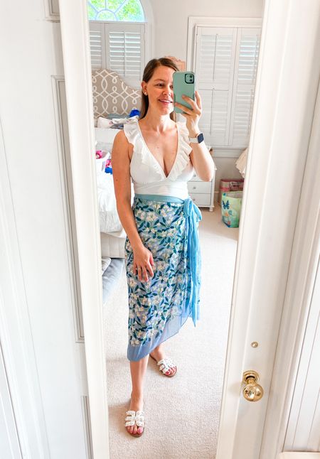 Loving this white one piece ruffle swimsuit paired with this fun sarong skirt! Amazon fashion finds. Wearing size medium in both.

#swimwear #swim #amazonfinds #amazonfashion #postpartum #beachwear #pooloutfit #summerstyle 

#LTKunder50 #LTKbump #LTKswim