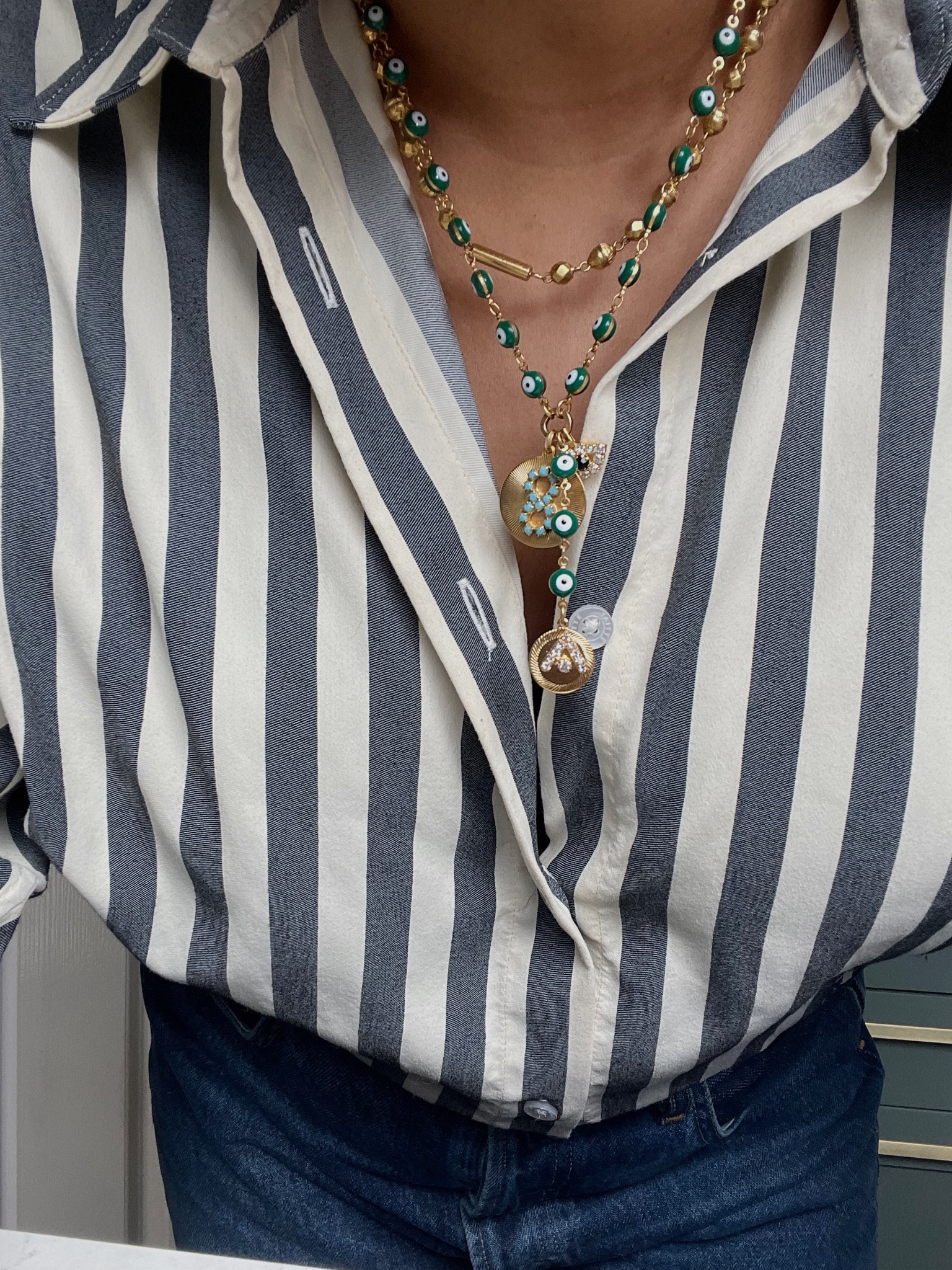 Evil eye necklace we all need 
Yaitte shirt 
Elizabeth Cole evil eye necklace 

#LTKstyletip #LTKeurope