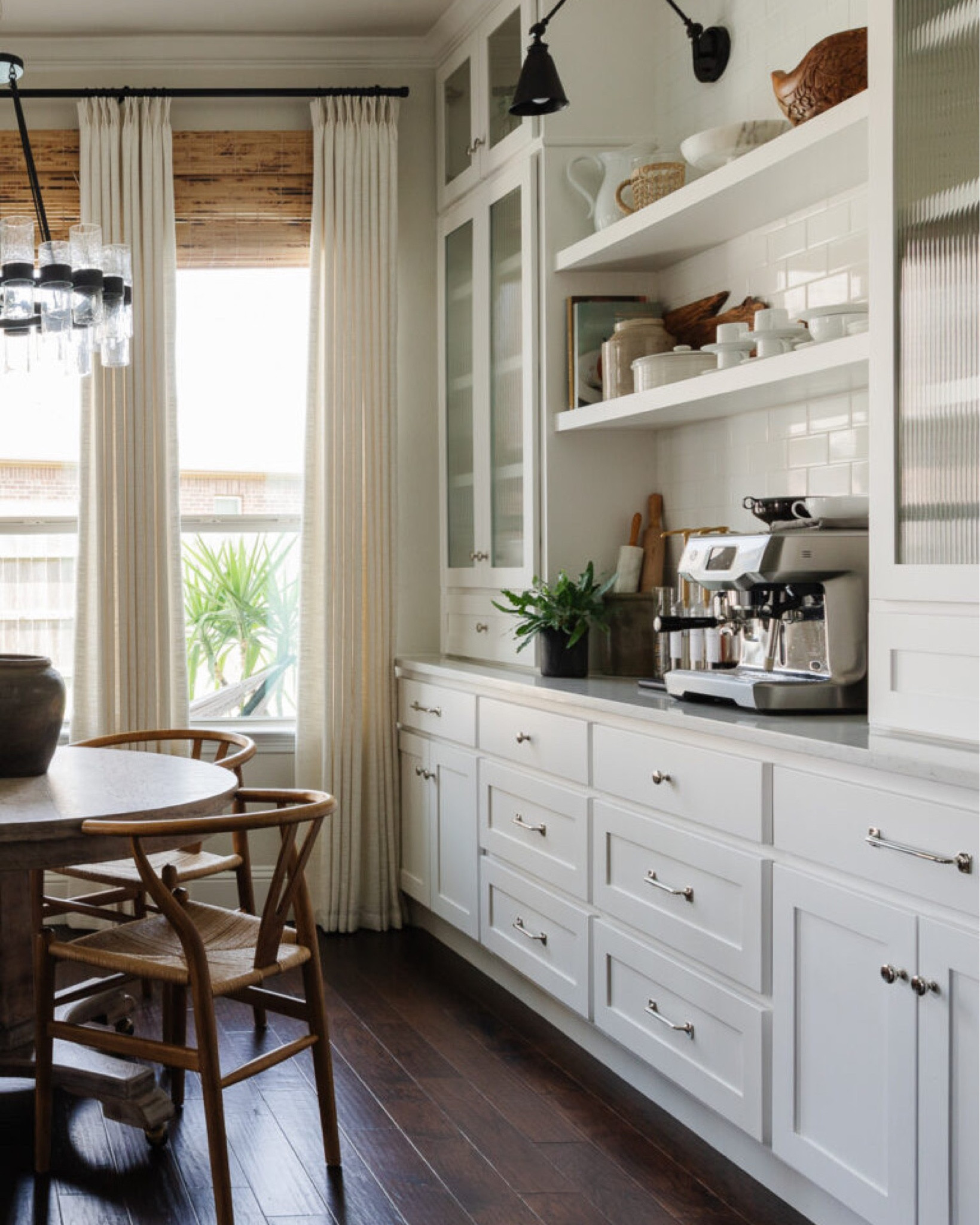 The coffee station side of our kitchen nook with our espresso machine and mug storage



#LTKhome