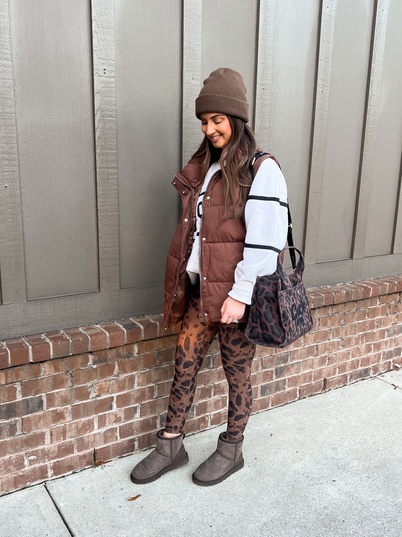 Brown puffer vest-large 
Go sports crème sweatshirt-large
Leopard leggings
Leopard coach tote bag
Brown Ugg boots 
Brown beanie 