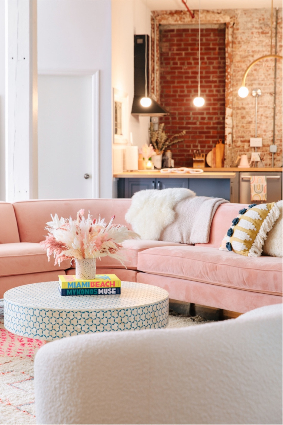 Pink sectional loft decor open studio loft floor plan living room in loft 

#LTKHome