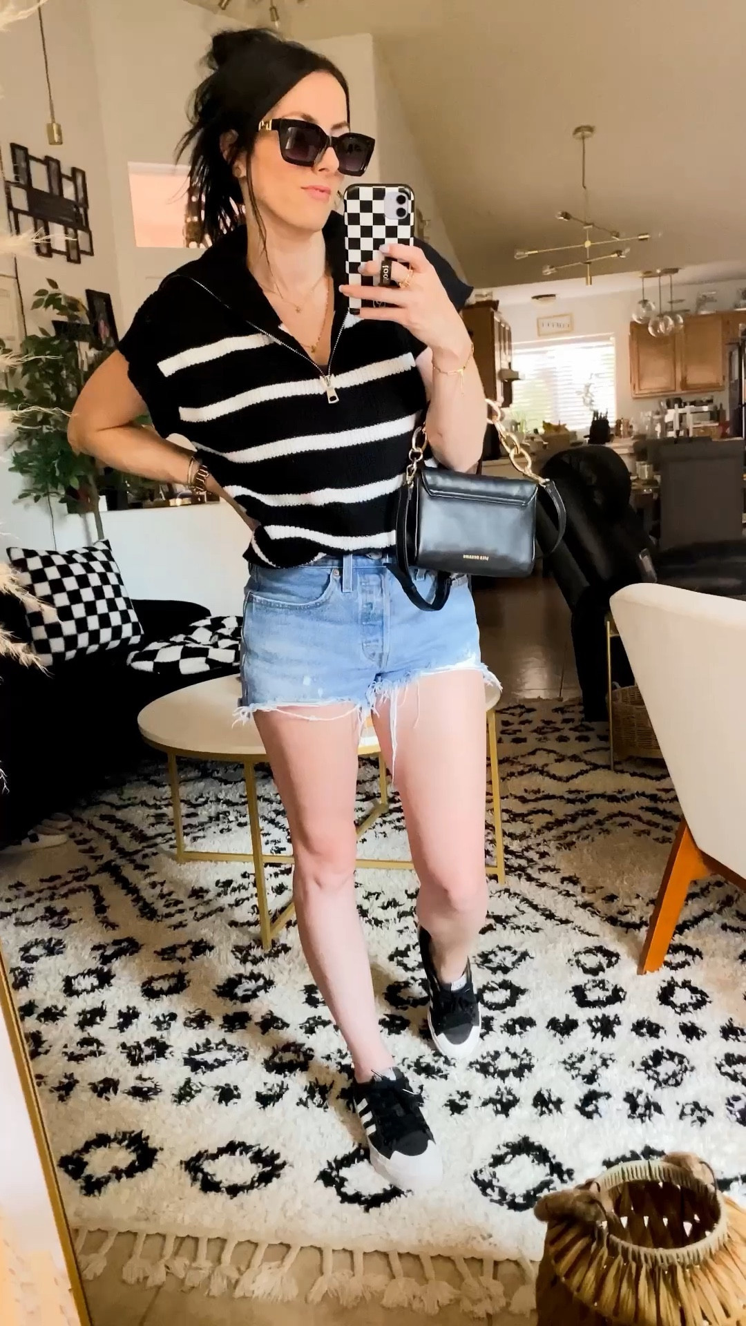 This knit sweater vest pullover is super cute! I loved that it has the half in the front, definitely adds some style to it. 
Fits on the looser side, I sized down to an Xsmall for a more fitted look. 
Material is pretty good, has small pin holes due to that knit, also washes well. 
Levi’s are my favorite style the 501 denim shorts. Fits decently tts. I am a true size 27 and those fit snug, but still fit. I also snagged a size 28 and those fit a tad looser, but comfortable! 
Just some sizing references. 
I am 5’3, 28waist/37hip size 27 or 5 small b. 
Sneakers are my absolute favorite off Amazon. They are the adidas originals nizza platform. Fits tts 
Sunglasses, hand bag, and necklace are also good quality options  

#LTKFind #LTKSeasonal #LTKstyletip