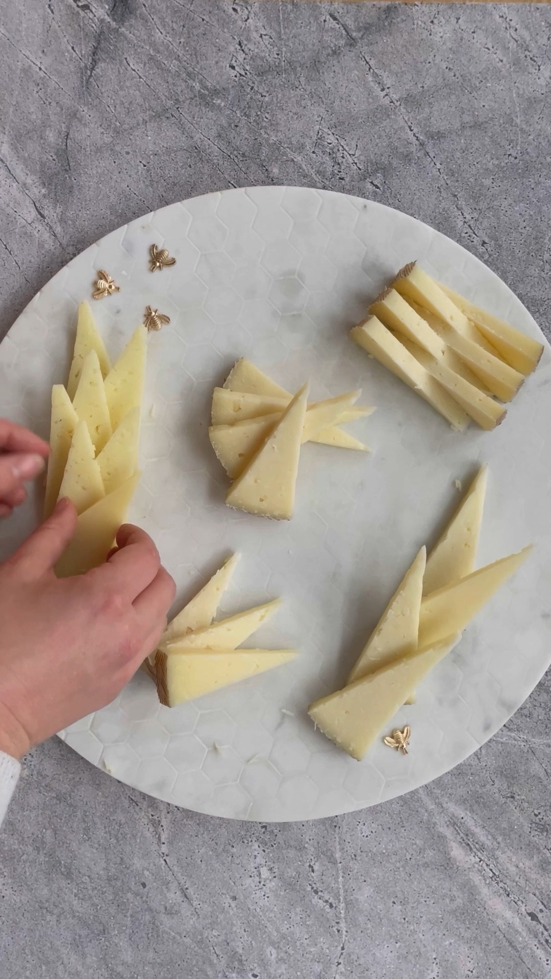 a commercial cheese cutter with a stunning marble platter 