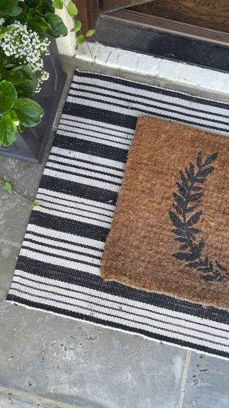 Our front door is cleaned up and ready for Summer! We have had this doormat for YEARS and it has held up so well. I also love how it looks layered with this striped outdoor rug too  

#LTKhome #LTKSeasonal