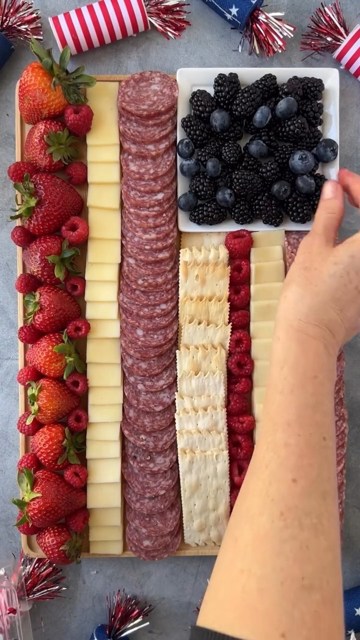 Note- If I were to do it again, I would make the 1st raspberry line with both strawberries and raspberries (like the last line). It looks a little thin compared to the rest.

But otherwise, it’s a pretty easy concept. Just alternate red and white rows and then put your blackberries or blueberries into a square plate and top with cheese stars.

INGREDIENTS

@columbusmeats Italian Dry Salame, sliced
monterey jack, sliced and also cut into stars
strawberries
raspberries
blackberries
@la_panzanella crackers

#4thofjulyfood #4thofjuly #charcuterie #charcuterieboard #thatcheeseplate #feedfeed #imsomartha

#LTKGiftGuide #LTKSeasonal #LTKHome