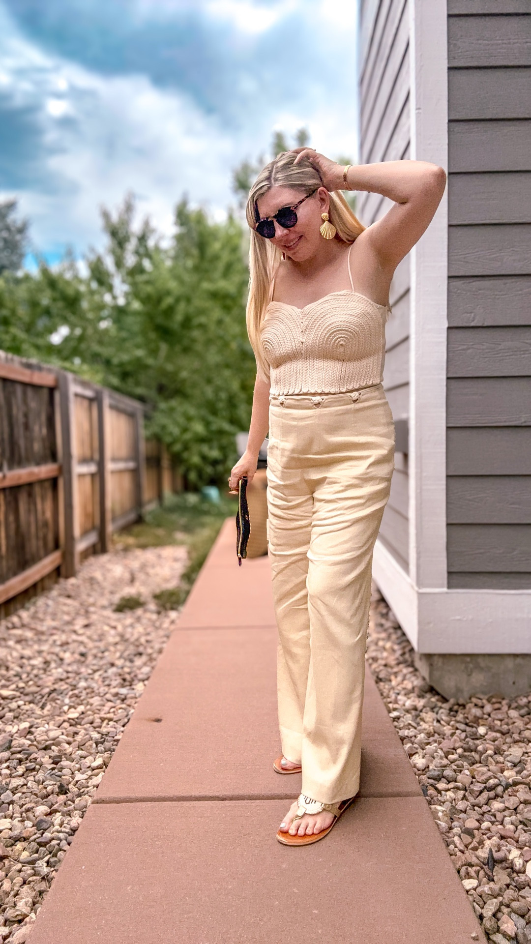 Look 13
Tropical Luxe 🌴 
A Curated Capsule Series 

Today’s Tropical Luxe look is a little more neutral than I usually go for… but I know you all love a luxe neutral moment, so here we are 🤍✨ Funny how getting out of my comfort zone means going more subdued! 

This rope-detail top (currently on super sale at Dillard’s!) is the star- act fast if you want it, because sizes are going quickly. I paired it with pants from last year’s Antonio Melani collection, layered on some of my favorite gold summer accessories for a polished feel, and finished it all off with monogram sandals to keep it comfy.

I used to think neutrals were boring, but I’ve learned that when the quality and detail are there, they don’t read “plain.” They read luxurious. Plus, the best part is — luxurious doesn’t have to mean expensive.

🌴 About Tropical Luxe: This capsule is all about luxe late-summer dressing - vibrant when you want it, neutral when you need it, but always elevated. It’s a shop-able capsule wardrobe for maximalists who love drama in the details.

💻 All outfit details are linked on my LTK - including this exact top while it’s still in stock!

We’re down to the last few outfits in this capsule 👀 what color do you think tomorrow’s look will be?

#DillardsStyle #AntonioMelani #TomFordStyle #TropicalLuxe #SummerStyle #LateSummerStyle #CapsuleWardrobe #NeutralStyle #OOTDInspo #summeroutfitideas 

#LTKShoeCrush #LTKSeasonal #LTKSaleAlert