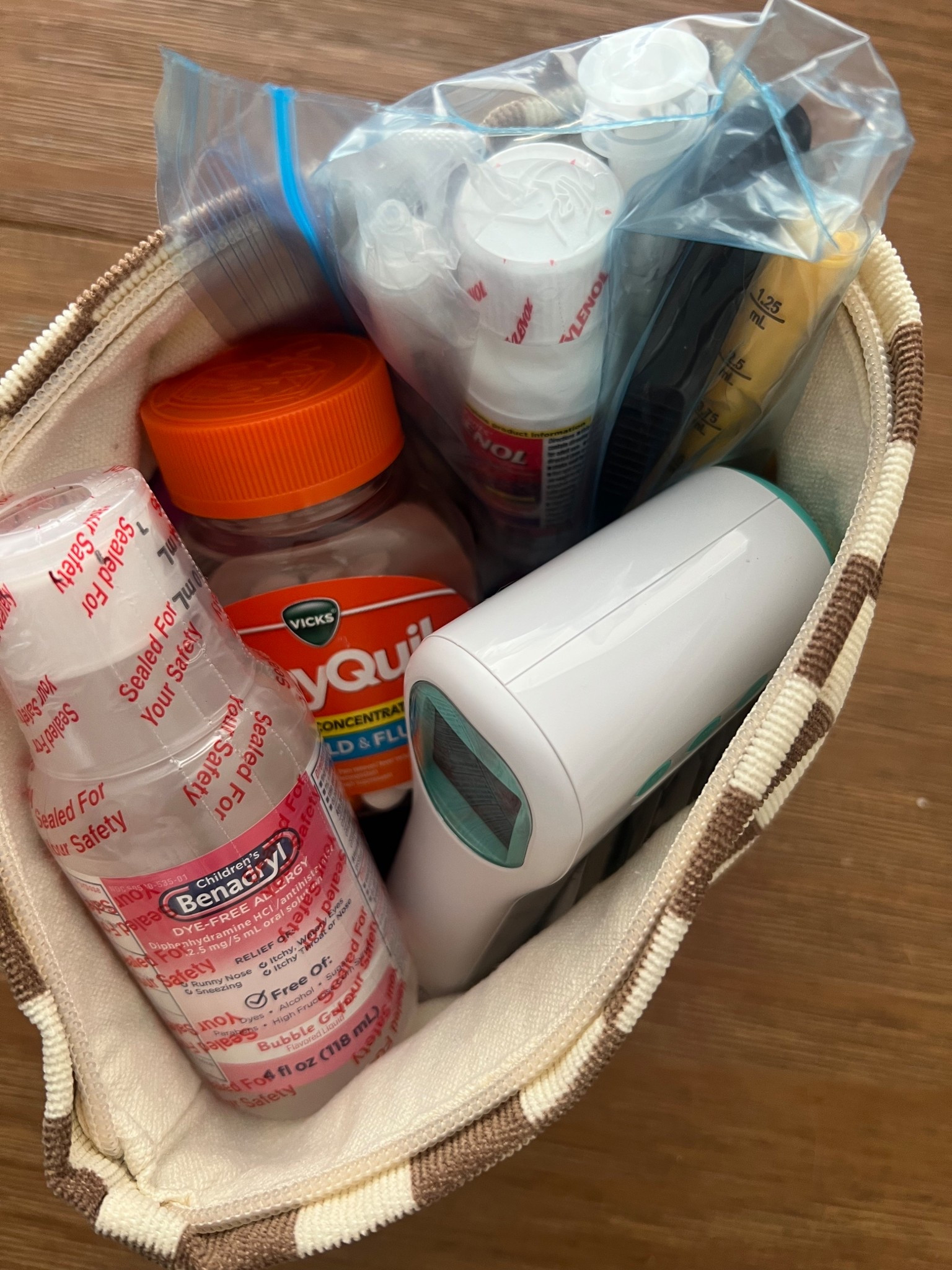 Packing the medicine bag for vacation 💊🩹 #firstaid #medicinebag #bandaids 

#LTKKids #LTKFamily #LTKFindsUnder50