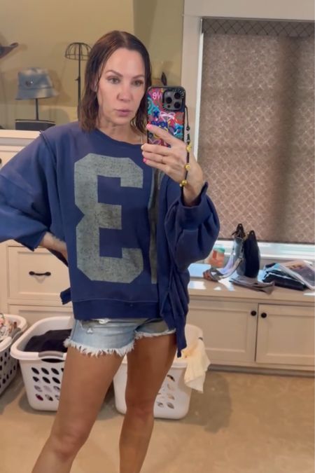 love this oversized sweatshirt from free people! Wearing a size small & size 25 in shorts

Cozy/comfy casual outfit inspo! 

#LTKFindsUnder100 #LTKActive #LTKStyleTip