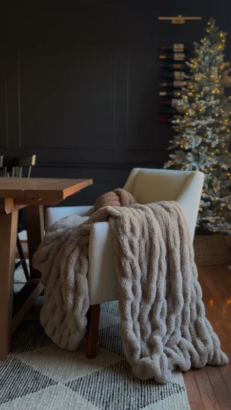 This $30 throw blanket is so versatile and perfect for holiday decor. I’ve had this faux fur blanket for years and I just love how it looks in any room. Comes in white, too!

Dining room decor, christmas dining room, Christmas decor, accent chair, accent pillow, boucle pillow, flocked Christmas tree, artificial Christmas tree, dining table, dining chairs, holiday decor#LTKHoliday 

#LTKSeasonal #LTKhome