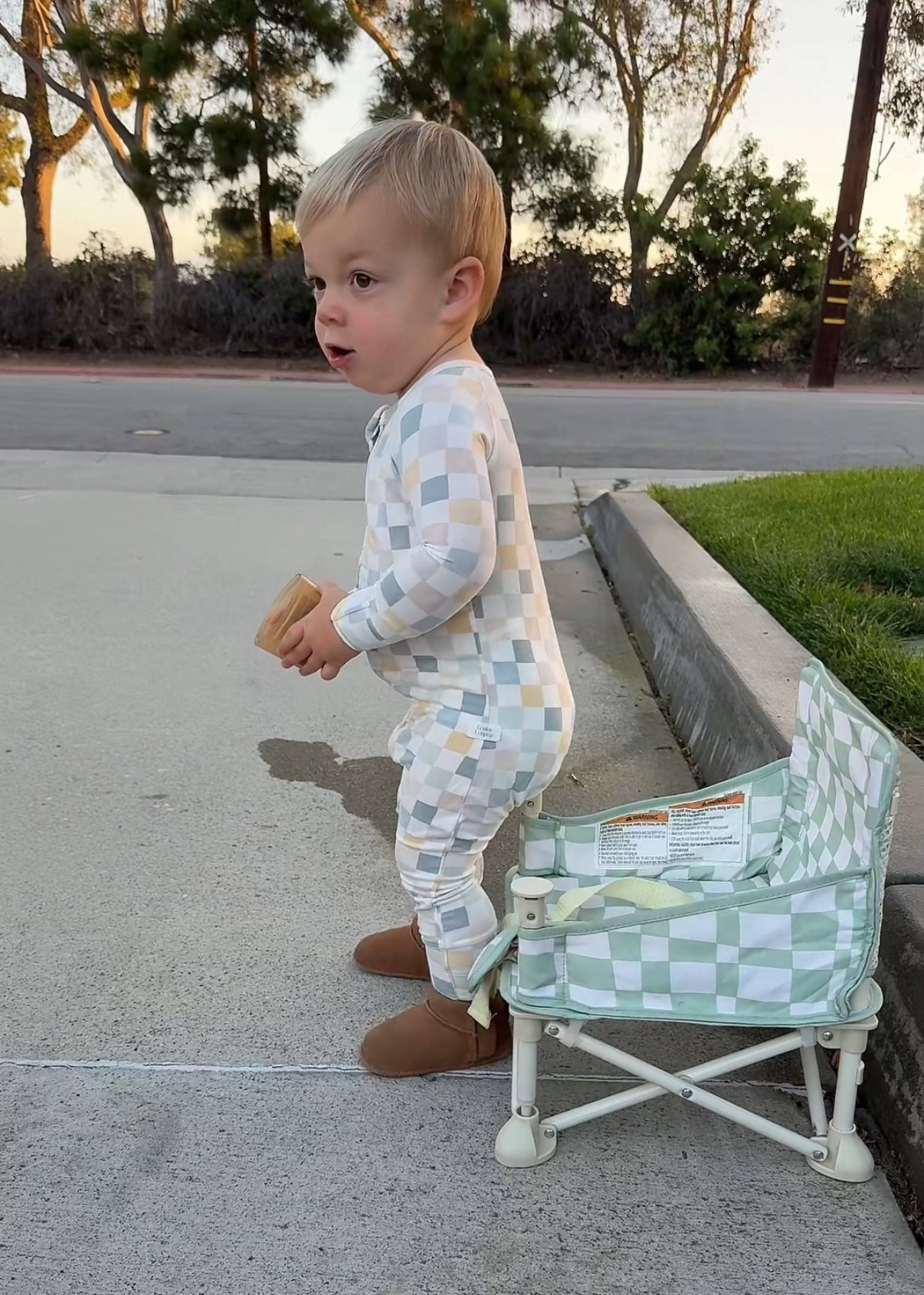 Coop's checkered pajamas, wearing a size 12-18mo