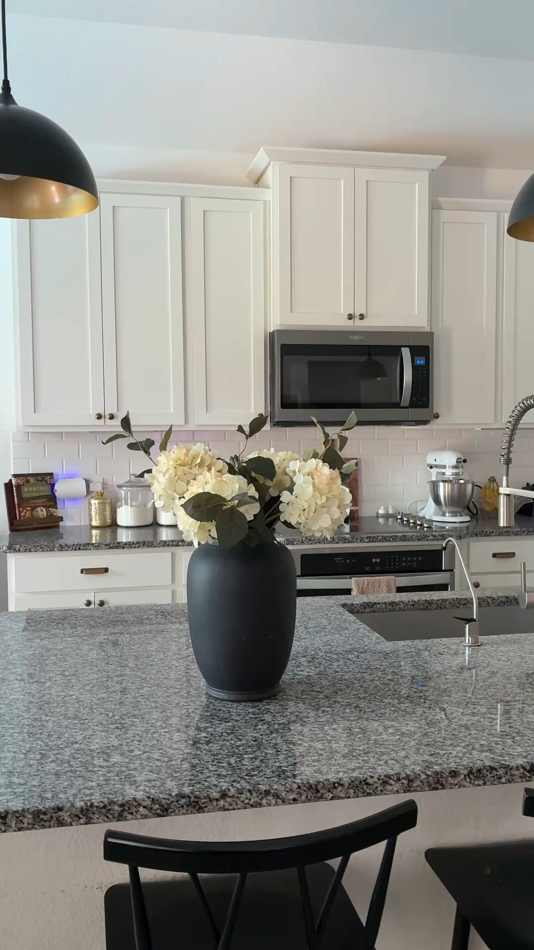 I have an ordinary kitchen that works hard for my family of 8 and looks and feels good. Be intentional about what you put on your countertops, add things like a vase of flowers just for fun and include decorative items that are beautiful and functional-think cutting boards, lamps, mixers, food storage containers, soap dispensers.

#LTKHome