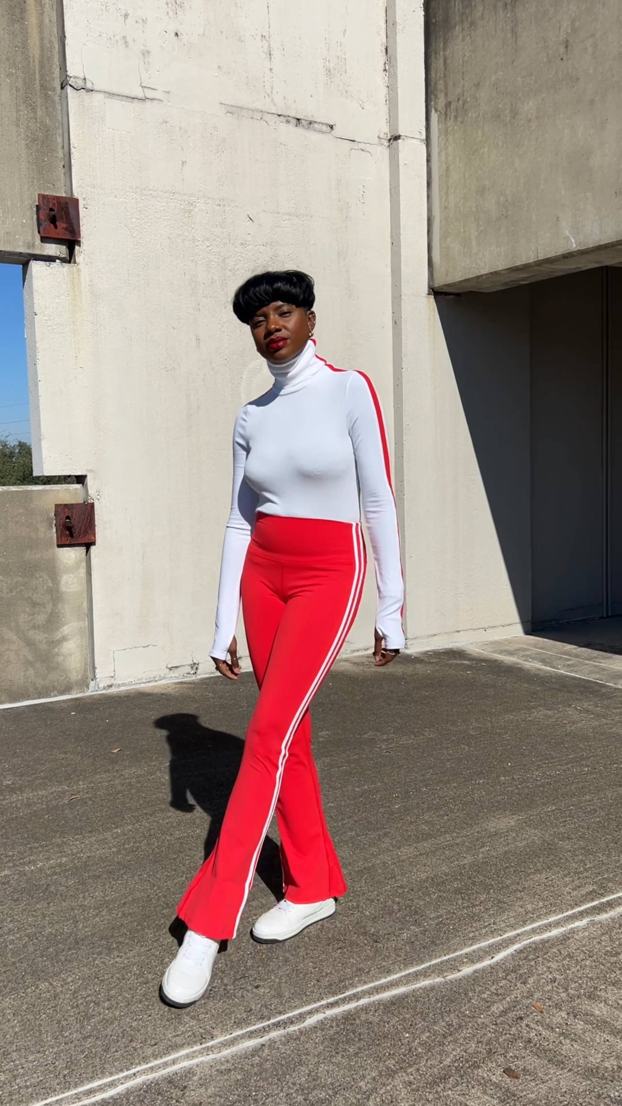 Warm workout set in two colors! Great travel outfits too  White turtleneck top with red stripes, red flare pants with white stripes. It also comes in orange. 

#LTKstyletip #LTKFind #LTKtravel