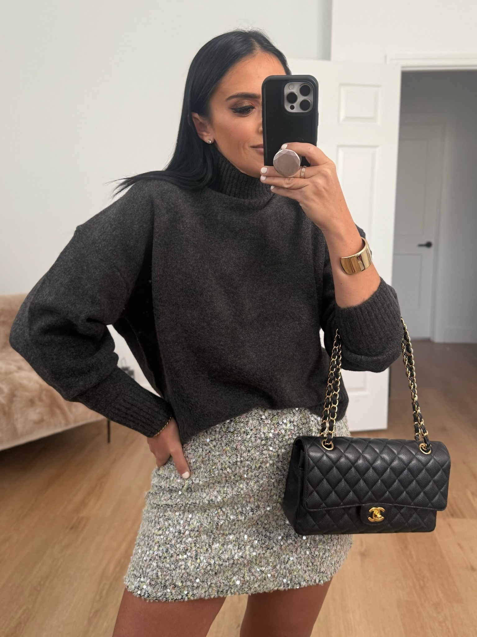 soft knit high neck jumper wearing size small. Sequin mini skirt wearing size medium. 