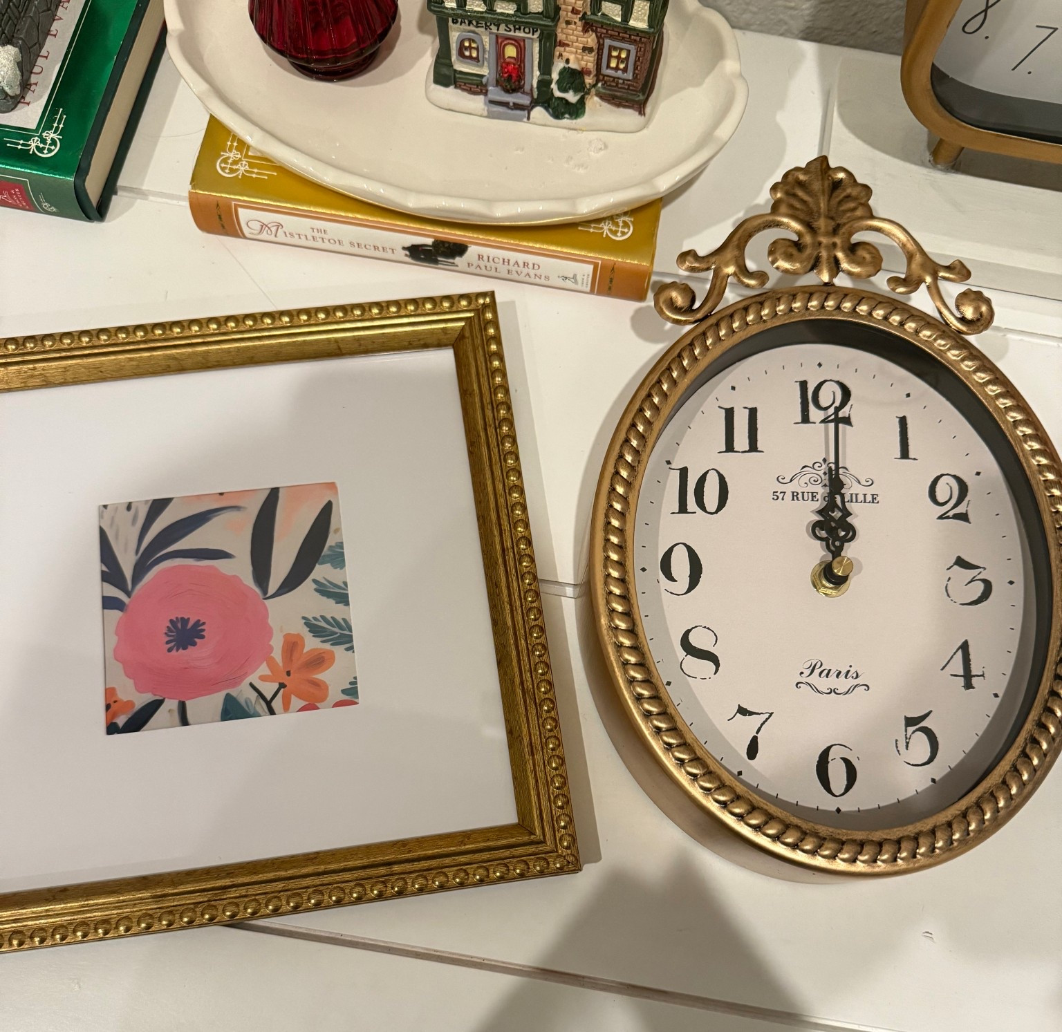 Gold oval wall clock gold picture frames 

#LTKHome #LTKFindsUnder50 #LTKSaleAlert