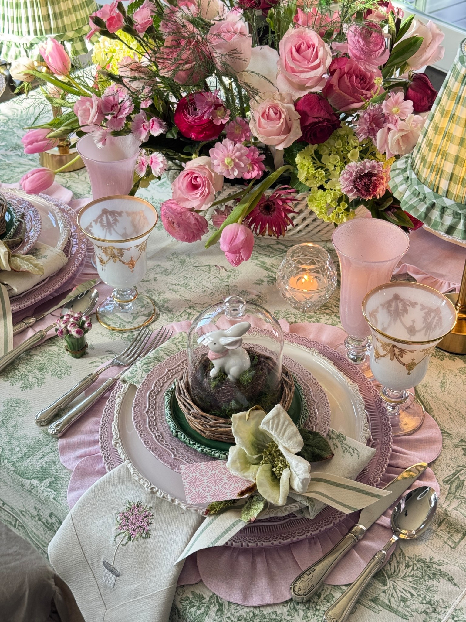 Let’s set a spring table — something that works for Easter, Mother’s Day, showers, or even a birthday.

I started by layering my linens for color and texture. That’s almost always my first step. Then I added a pink charger to anchor everything.

The cream dinner plate breaks up the pattern just enough so it doesn’t feel busy, and I love how the wrapped napkin pulls that toile color right back into the design. Little repeats like that make a table feel thoughtful.

On top, I added a pink salad plate to echo the charger, and then a green bread-and-butter plate tucked under the cloche for a fresh pop. @Arte Italica

#LTKHome #LTKWedding #LTKSeasonal