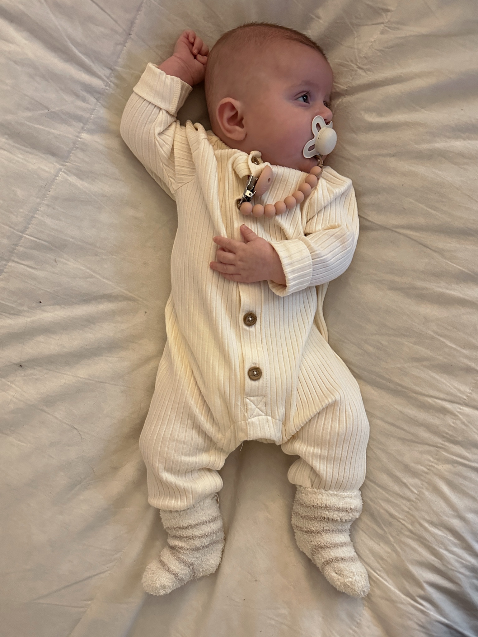 The cutest cream baby onesie from Target! I also love her little baby Barefoot Dreams socks 🤍🤍🤍

#LTKfindsunder50 #LTKbaby