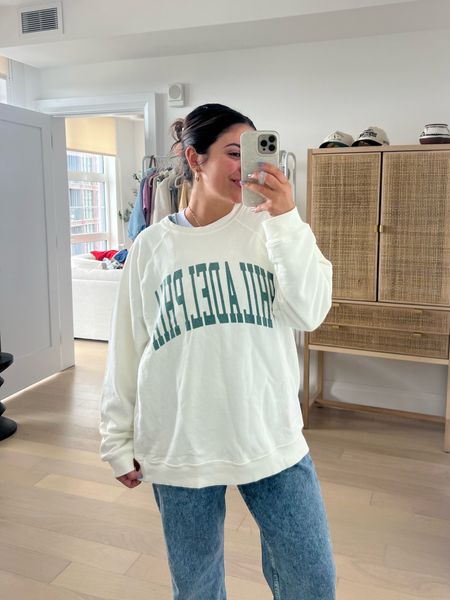 Super cute Philadelphia crewneck from Free People. I literally have been stalking this sweater and it just came back in stock - always sells out really quick. Super lightweight, great for spring and summer. I did my true size which is a medium, and it is oversized! 100% recommend 😊

#LTKSeasonal #LTKstyletip