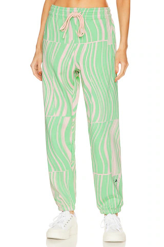 adidas by Stella McCartney True Casuals Sweatpant in Screaming Green & Blush Pink from Revolve.co... | Revolve Clothing (Global)