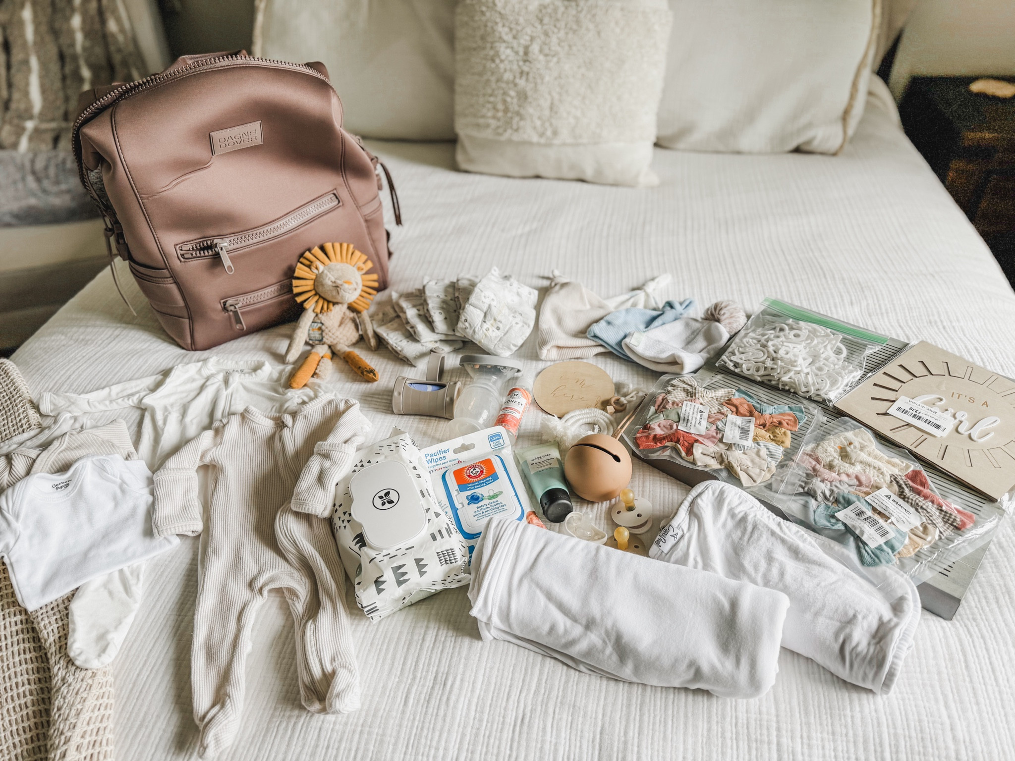 Packing our new large Dange Rover diaper bag with all the essentials and our extras for the gender reveal, name announcement, and 48 hour fresh photos. This all fit in our diaper bag which I was so impressed with! Baby, we are ready when you are! 

#LTKBump #LTKItBag #LTKBaby