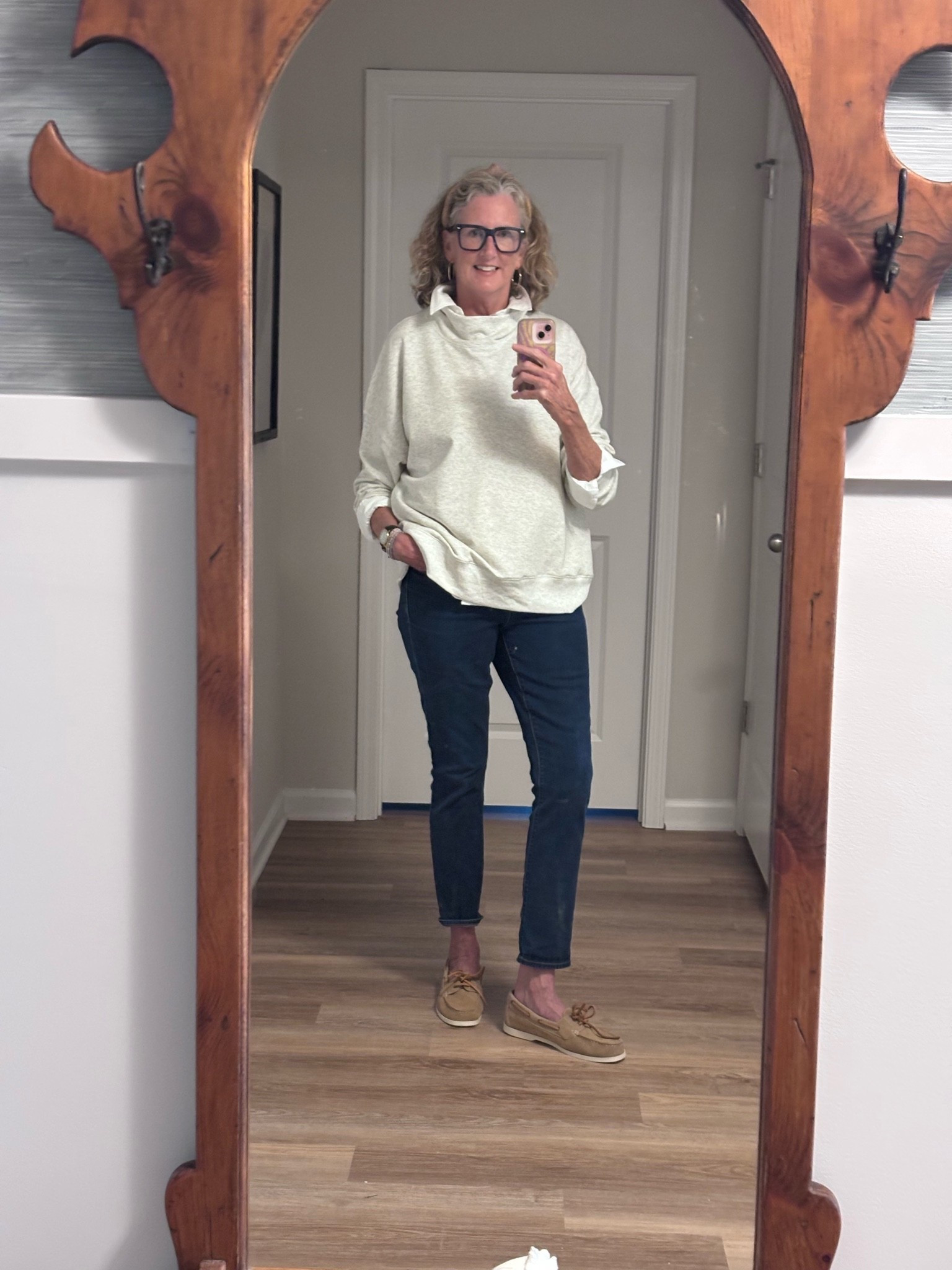 Wearing this mock neck oversized sweatshirt in XL for extra slouch, worn with a button down and boat shoes for a preppy look.

#LTKOver40 #LTKTall #LTKootd