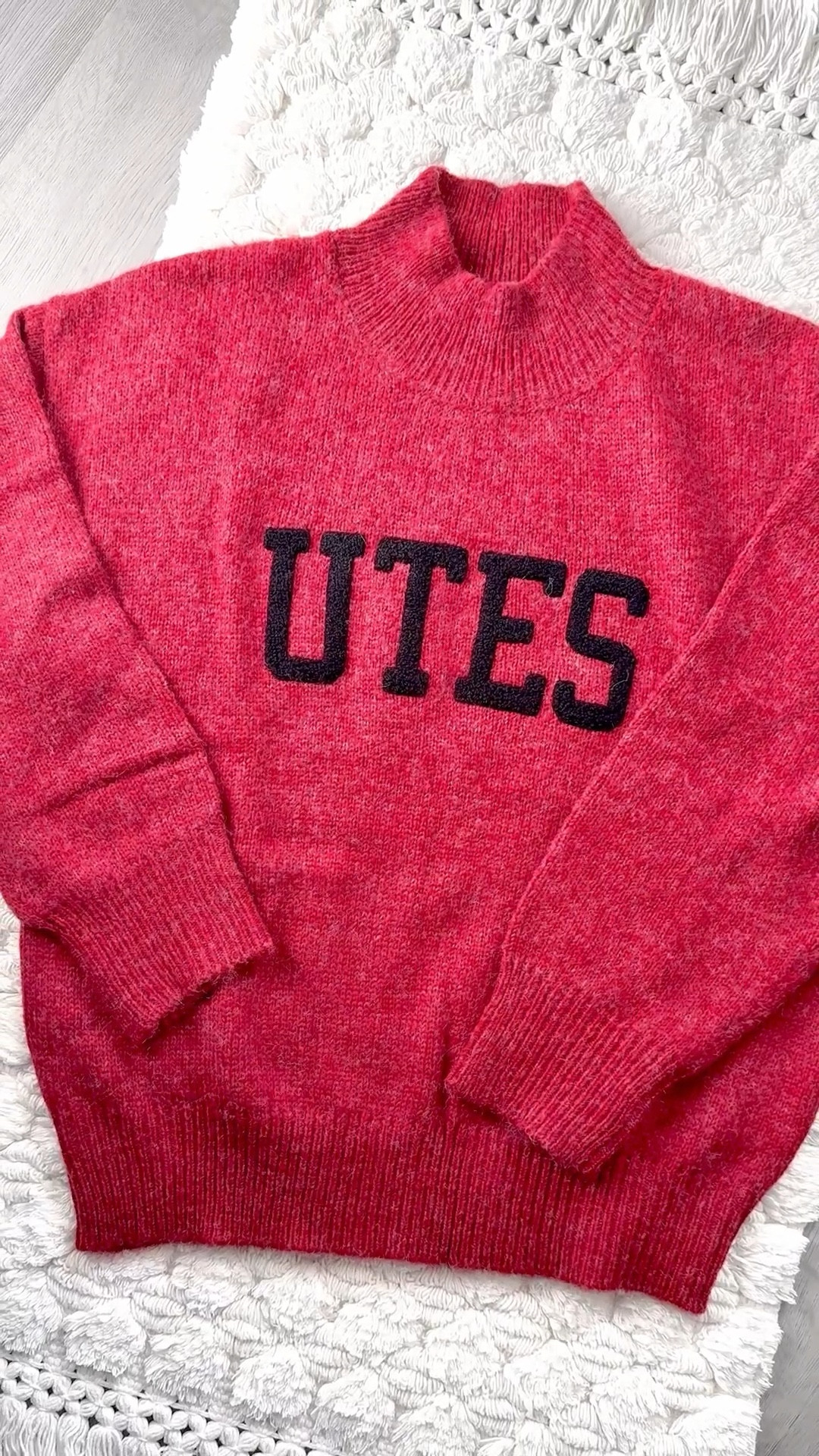 This cozy “UTES” mock neck sweater is that perfect mix of classic + elevated. The rich, heathered red is insanely flattering, the bold black lettering pops without feeling overly sporty, and the relaxed, slightly slouchy fit gives it that effortless, model-off-duty vibe. The chunky ribbed collar, cuffs, and hem make it feel high-end and extra warm for those chilly stadium nights.

I’ve collected way too many pieces at this point, and every single one is soft, flattering, and made to actually be worn on repeat.
Fabric feels soft (not itchy), warm without being heavy, and lays beautifully without clinging. It’s the kind of sweater you can dress up or down — and yes, it looks just as cute after game day for brunch, errands, or travel.

I love styling it with:
• Black leggings + sneakers or boots for game day
• Straight-leg denim + a baseball cap for casual days
• A leather or puffer jacket layered on top for colder temps
• Gold hoops + slicked-back bun for that effortless vibe

And the best part — they have SO many other colleges too, so whether you’re a Utah girlie or cheering for another team, you can find the same elevated style for your school.

A must-have for football season, basketball season, and all the cozy months in between. 

Utah Utes • U of U Style • Go Utes • UTES • Game Day Outfit • College Game Day • Collegiate Style • College Fashion • Sporty Chic • Neutral Style • Fall Outfits • Winter Outfits • Cozy Season • Mock Neck Sweater • Statement Sweater • Oversized Sweater • Athleisure Style • Campus Style • Street Style Inspo • Football Season Style • Stadium Style • Tailgate Style • College Outfits • Elevated Casual • Fan Gear • College Merch • Game Day Style • College Must Haves

#LTKootd #LTKSaleAlert #LTKU