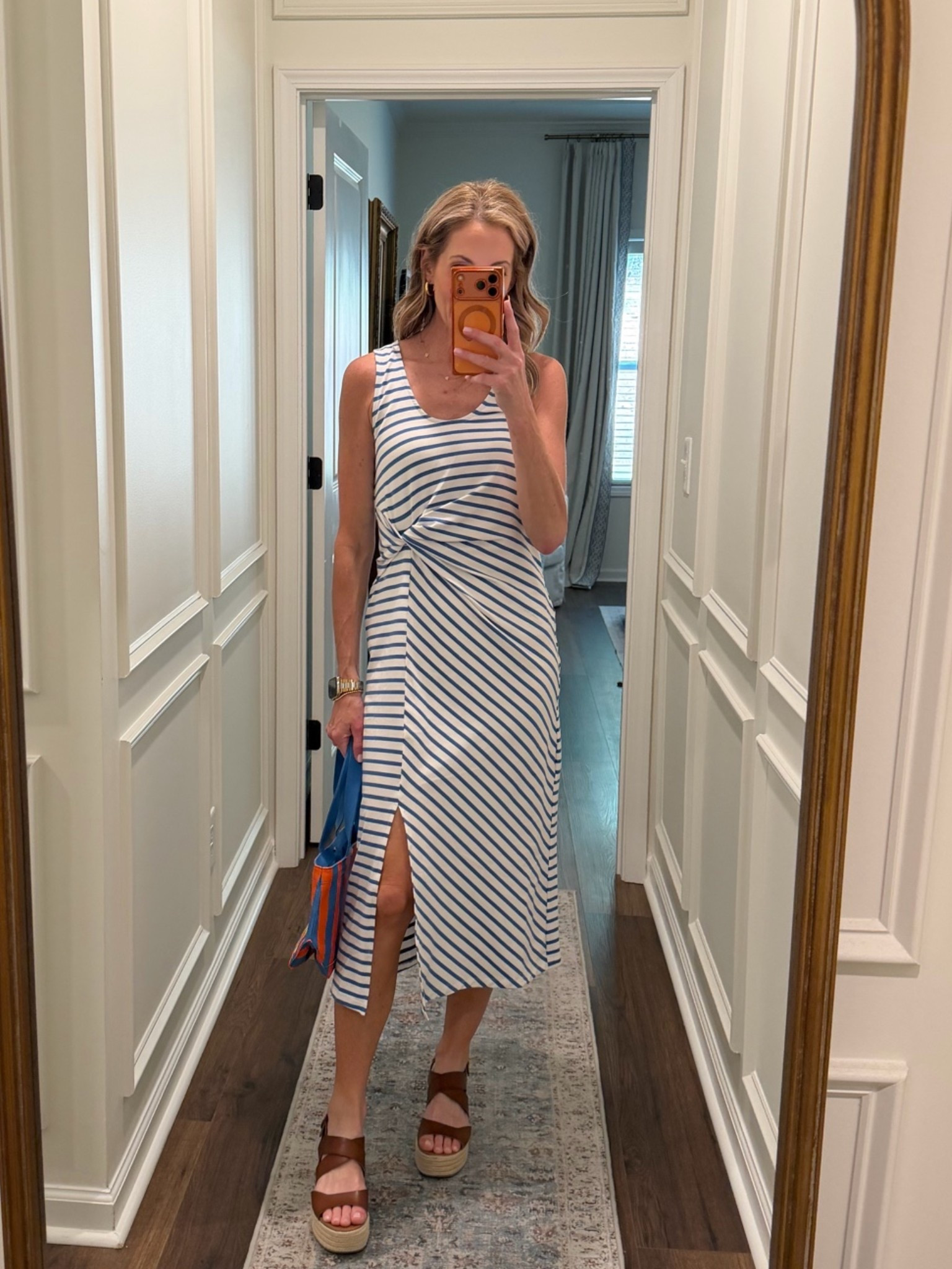On sale under $30 this twist midi dress is a perfect choice for casual outings or dressed up evenings. Wearing a size small.