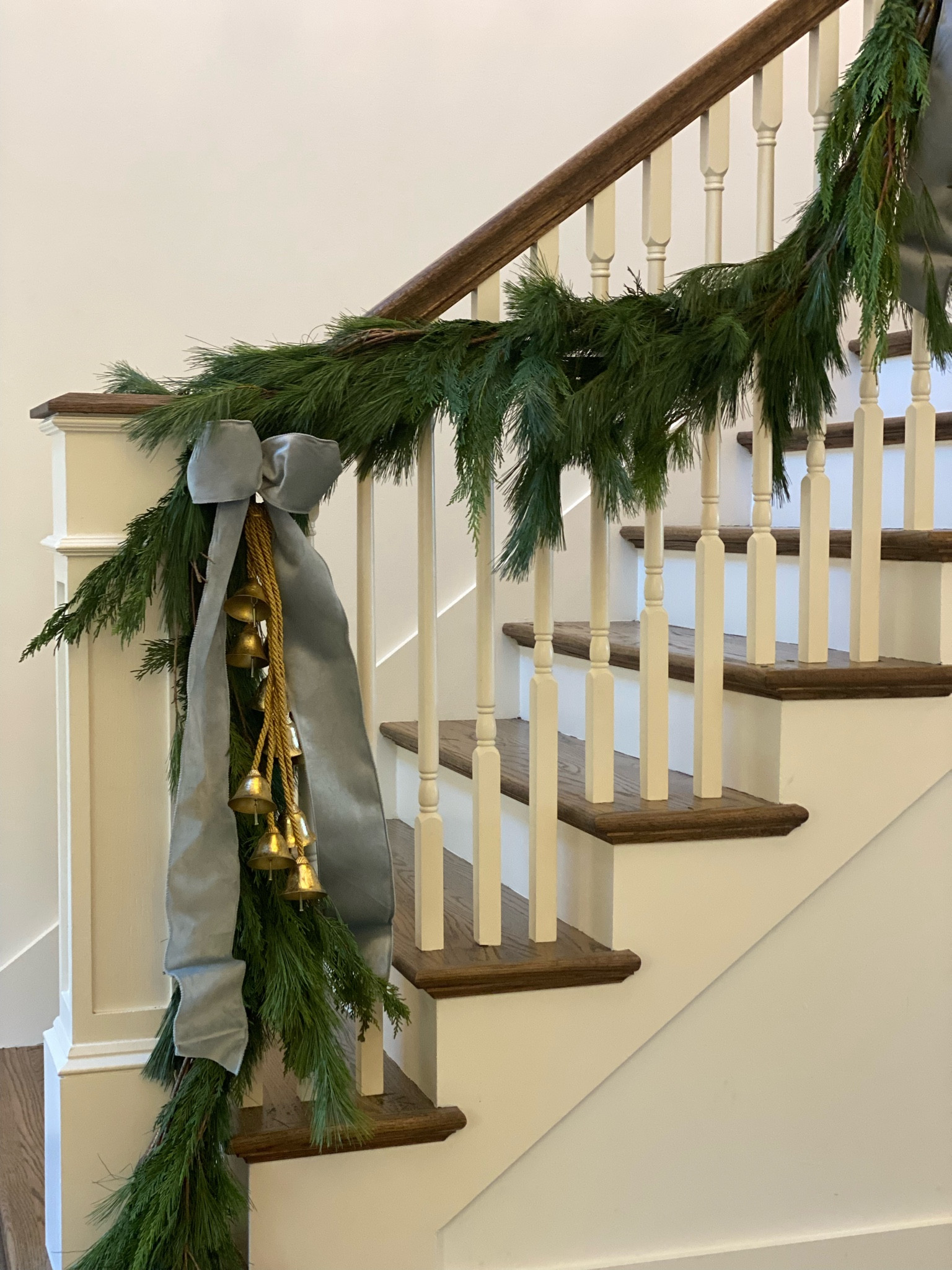 Holiday decor, Christmas stairs, garland, bells, blue Christmas decor, gold bells

#LTKSeasonal #LTKHoliday #LTKhome