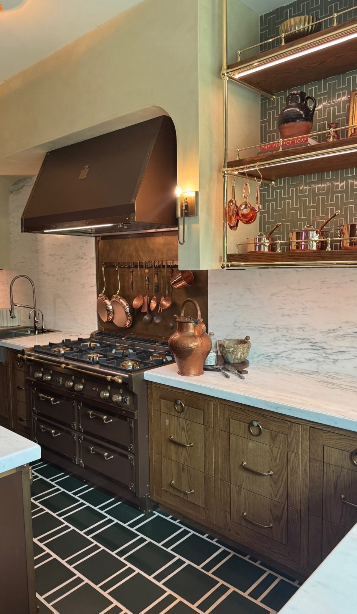 Vintage European-inspired kitchen with a luxe twist — featuring a rich bronze La Cornue-style range, classic copper cookware, warm wood cabinetry, and striking emerald green tile floors. Marble countertops and brass accents elevate the space, while open shelving adds a curated, artisanal touch. A dream space for elegant cooking and timeless charm.

#LTKHome
