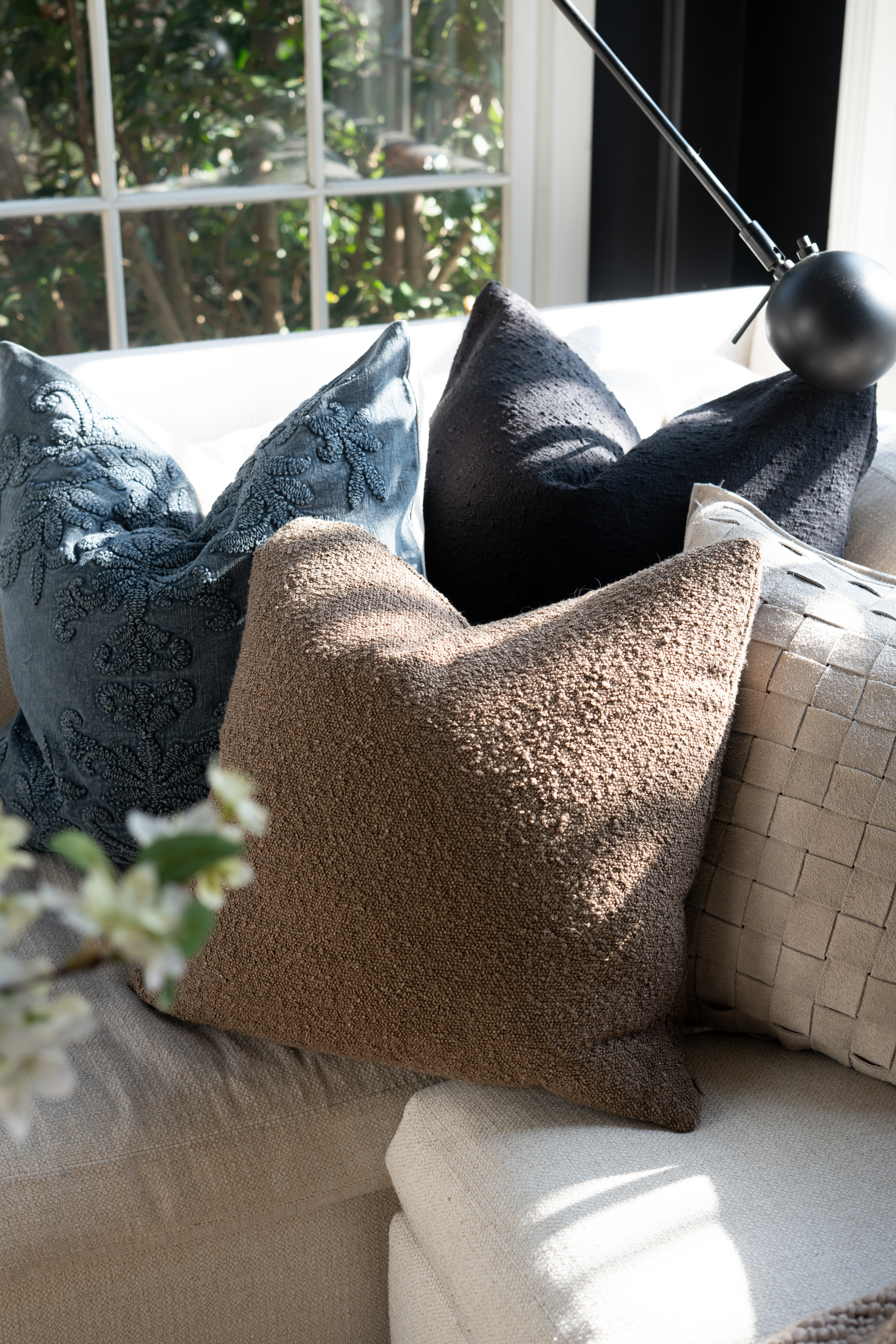 You guys I am seriously freaking out over this pillow moment. The mix of soft blue, rich neutrals, and textured fabrics makes this living room feel so cozy and elevated. Add the natural light and I honestly cannot think of a more perfect spot to curl up. It's true heaven!  

 #LTKSpringSale #LTKSeasonal #LTKHome
