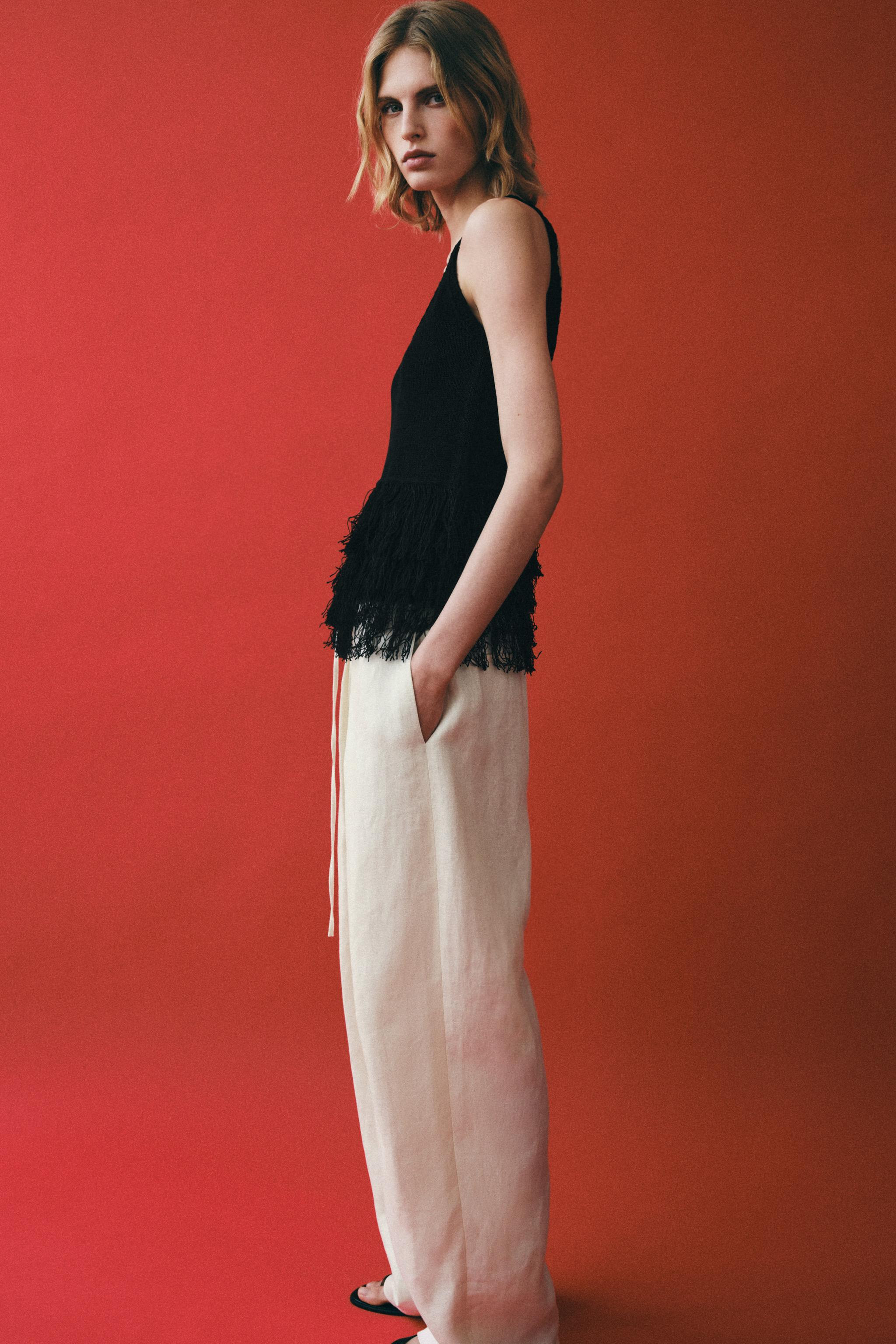 Round neck top with wide straps and a fringed hem. | Zara US